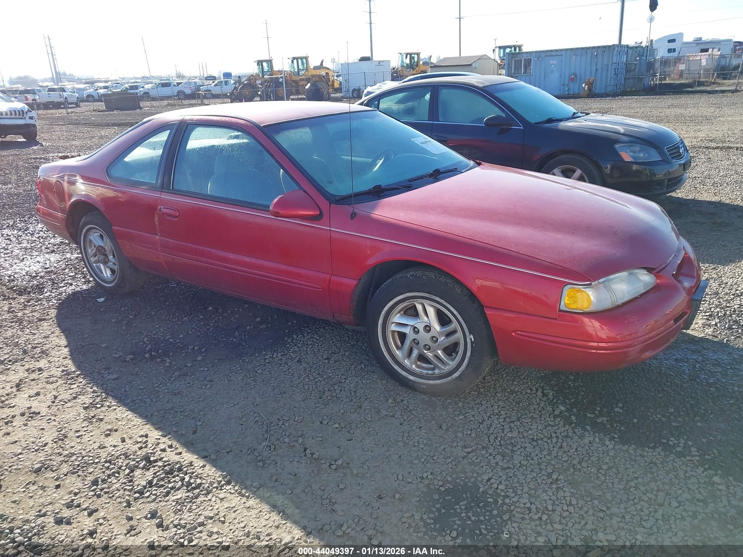 1997 Ford Thunderbird LX, VIN 1FALP62W7VH150912 — Side
