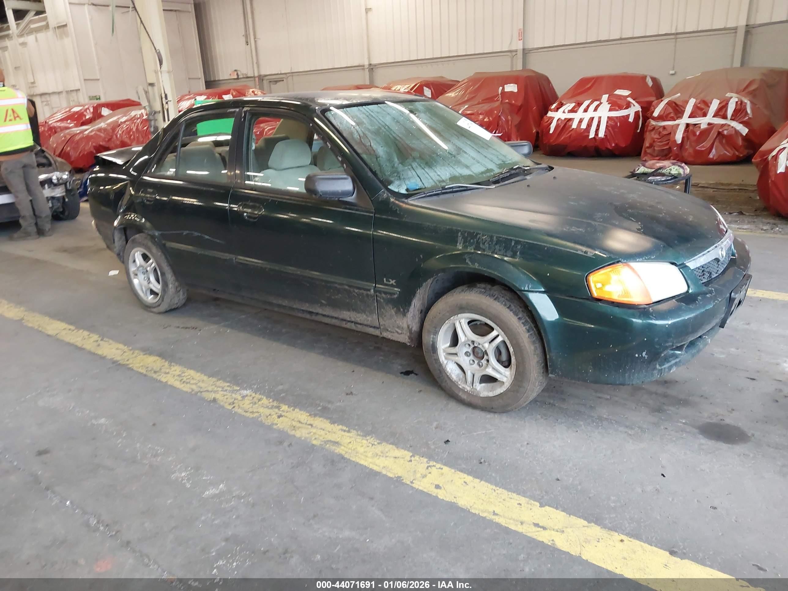 1999 Mazda Protege DX, VIN JM1BJ2229X0121197 — По всему кузову