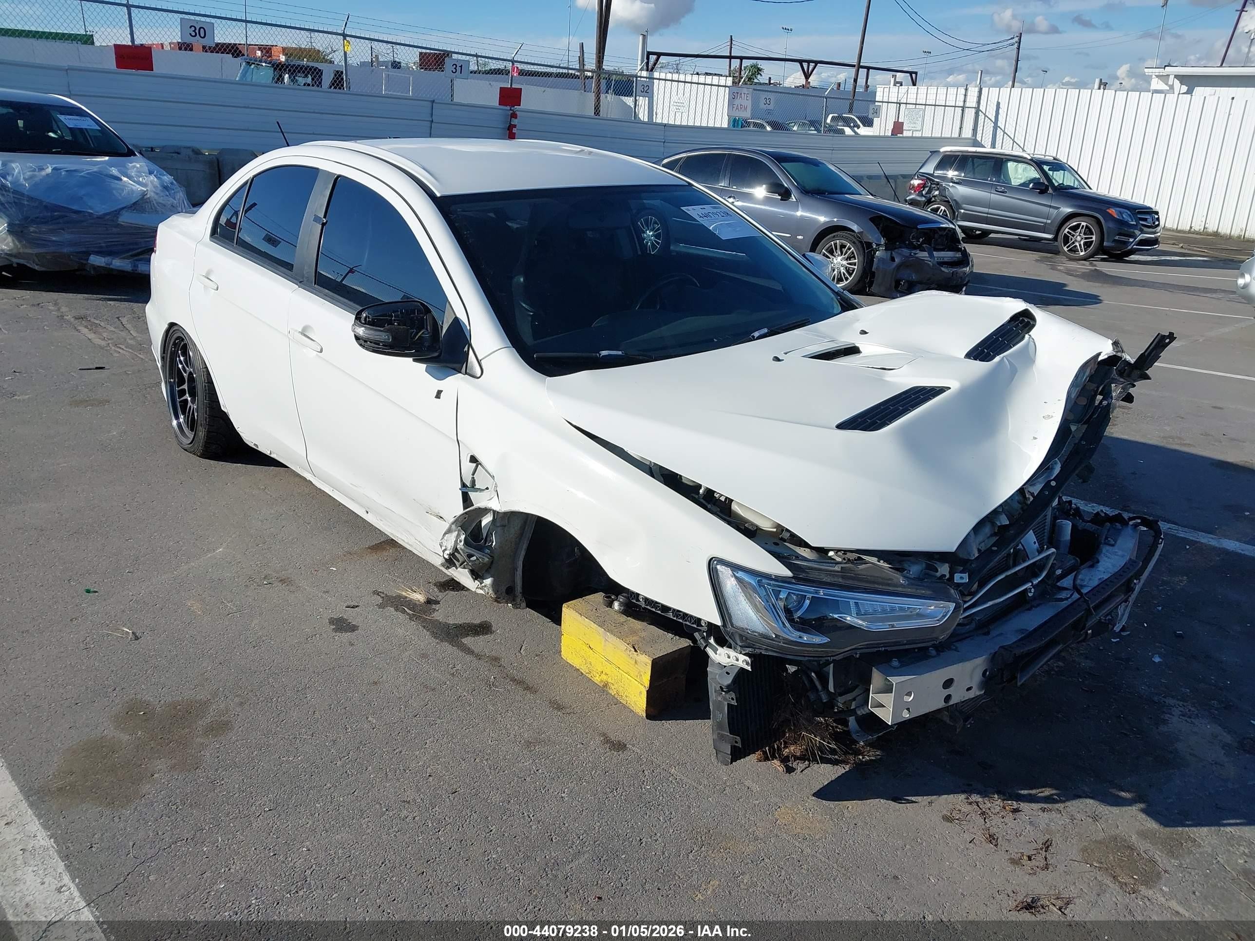 2015 Mitsubishi Lancer Evolution GSR, VIN JA32W8FV2FU018220 — Front end