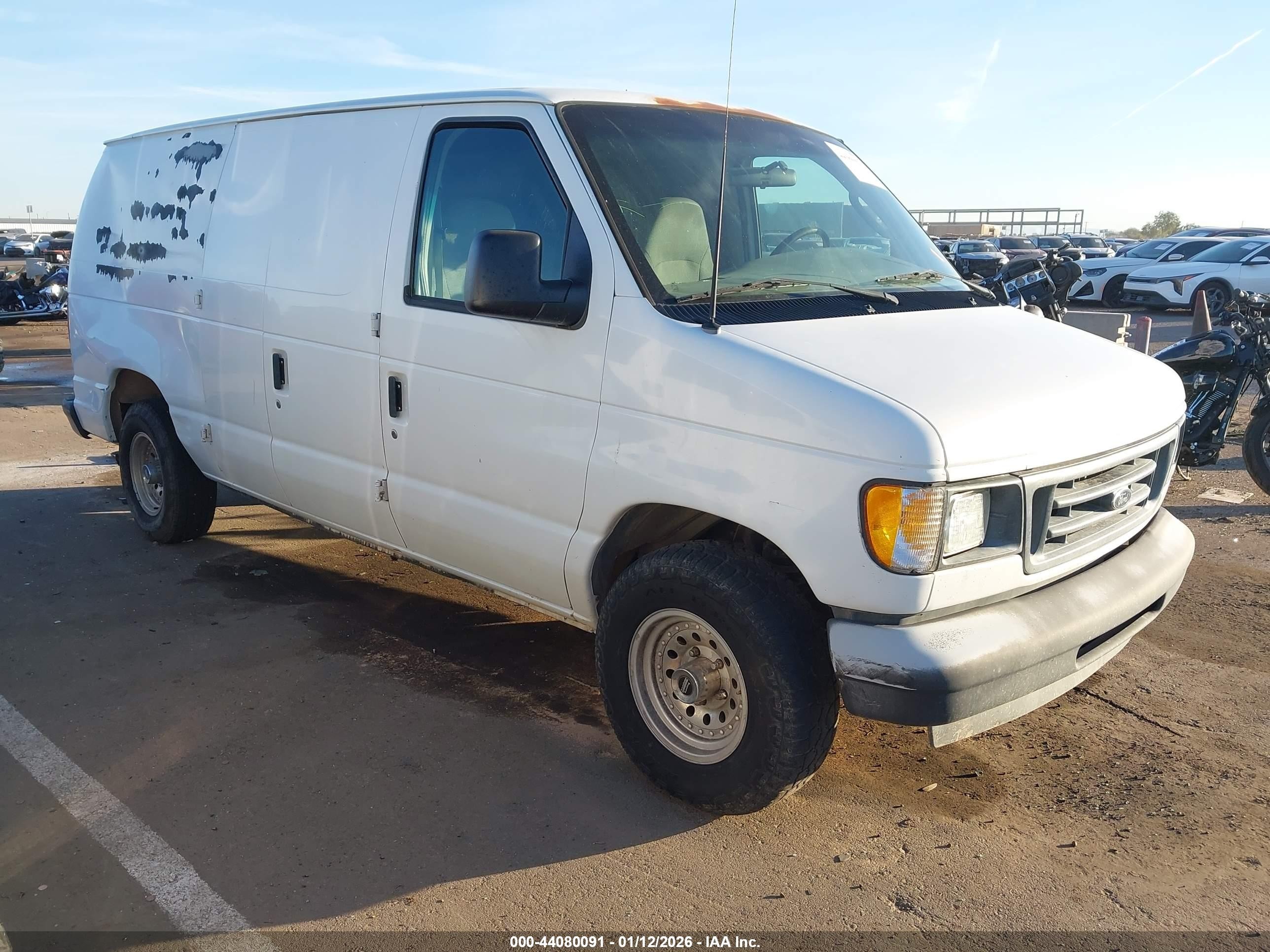 2003 Ford E-150, VIN 1FTRE14L43HA28960 — Rear end