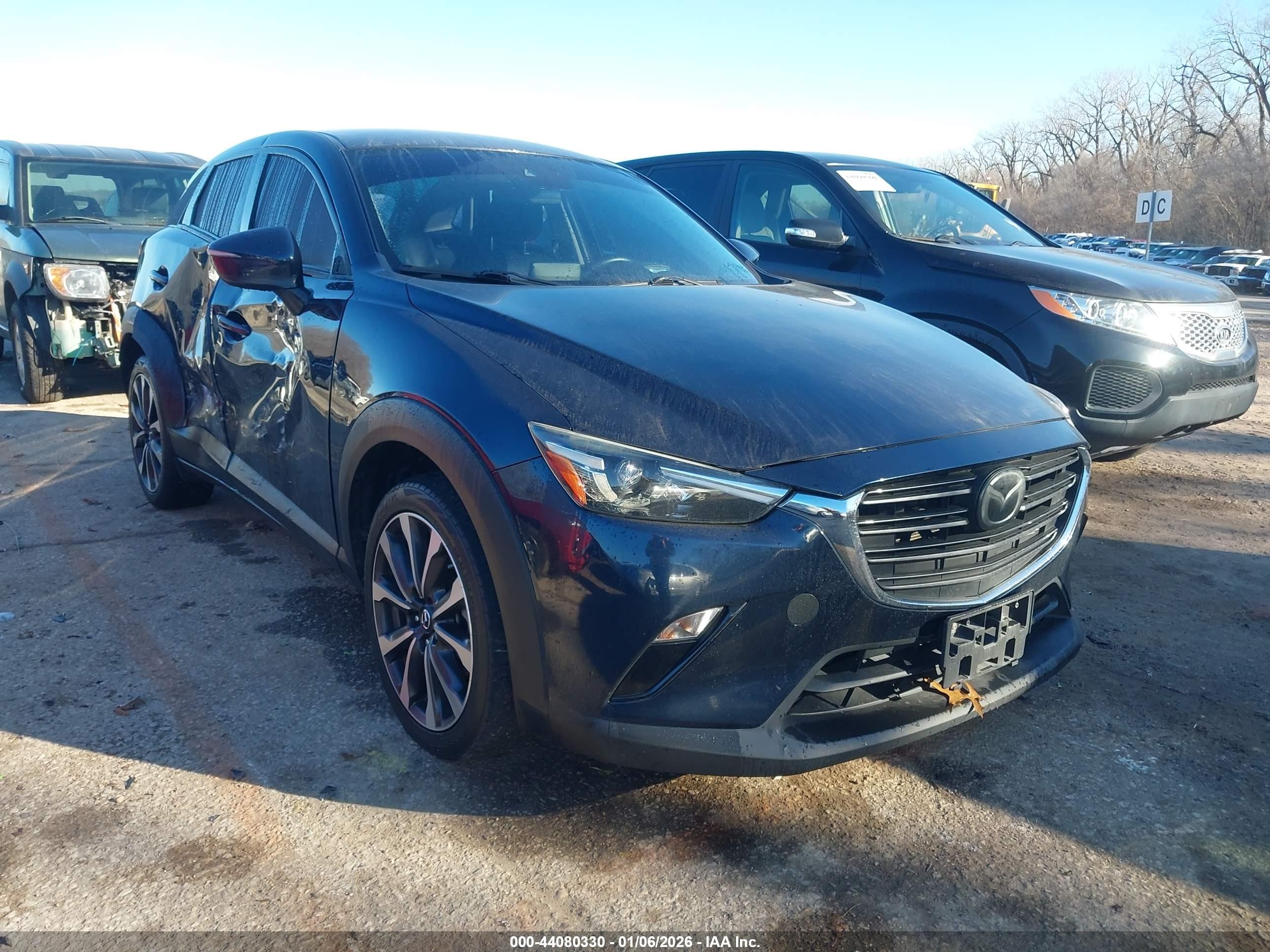 2019 Mazda CX-3 Touring, VIN JM1DKFC73K0449571 — Side