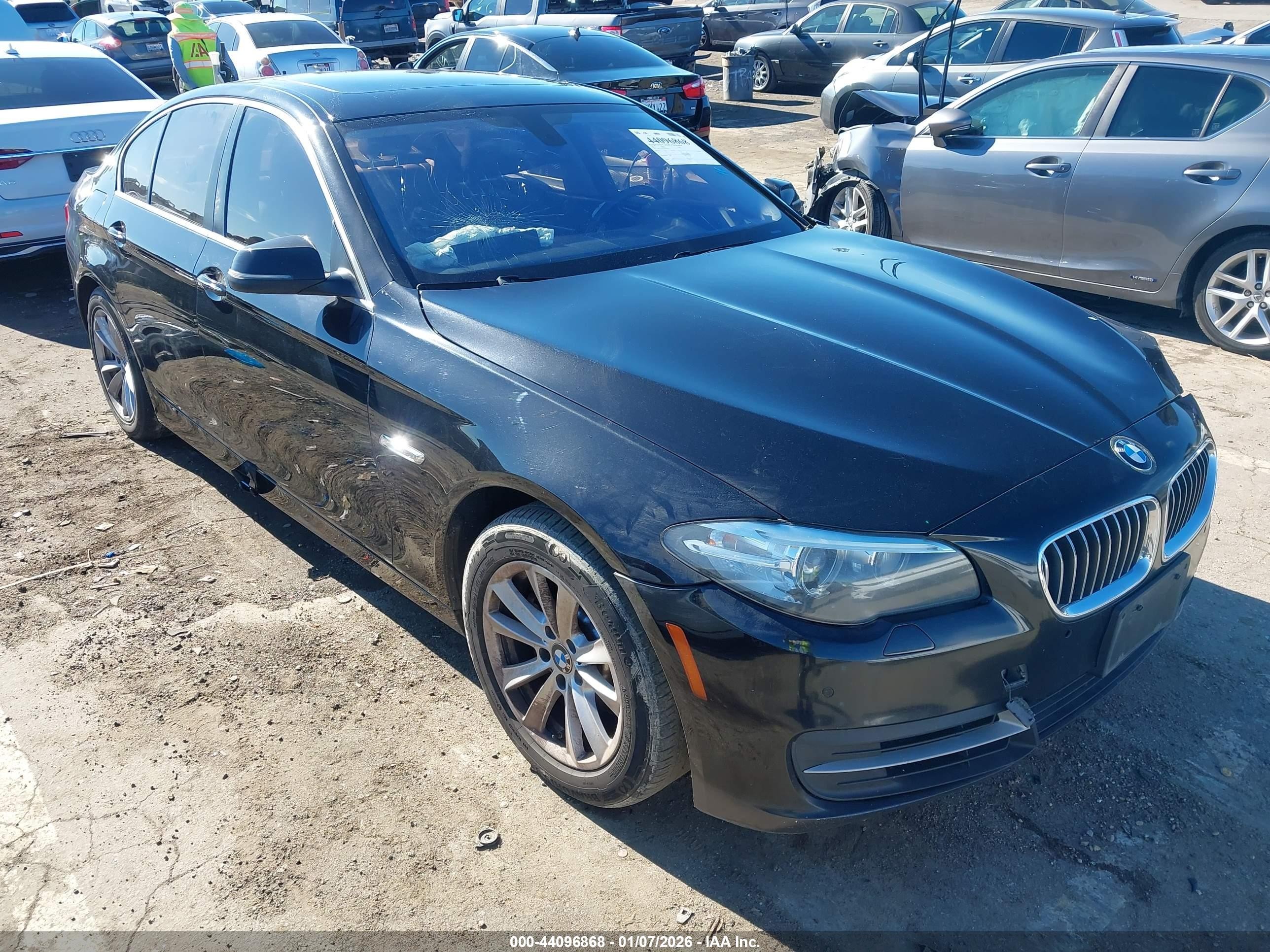 2014 BMW 5 Series 528i, VIN WBA5A5C50ED509011 — Side