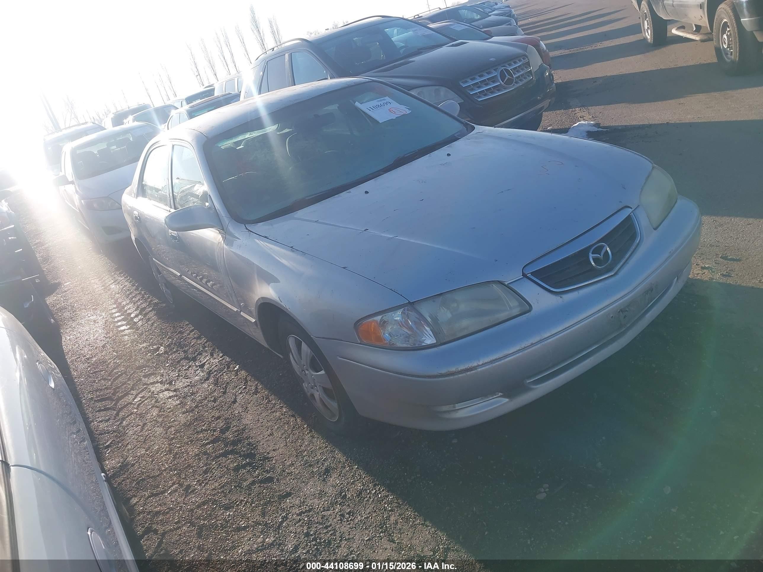 2001 Mazda 626 LX, VIN 1YVGF22D615212294 — По всему кузову
