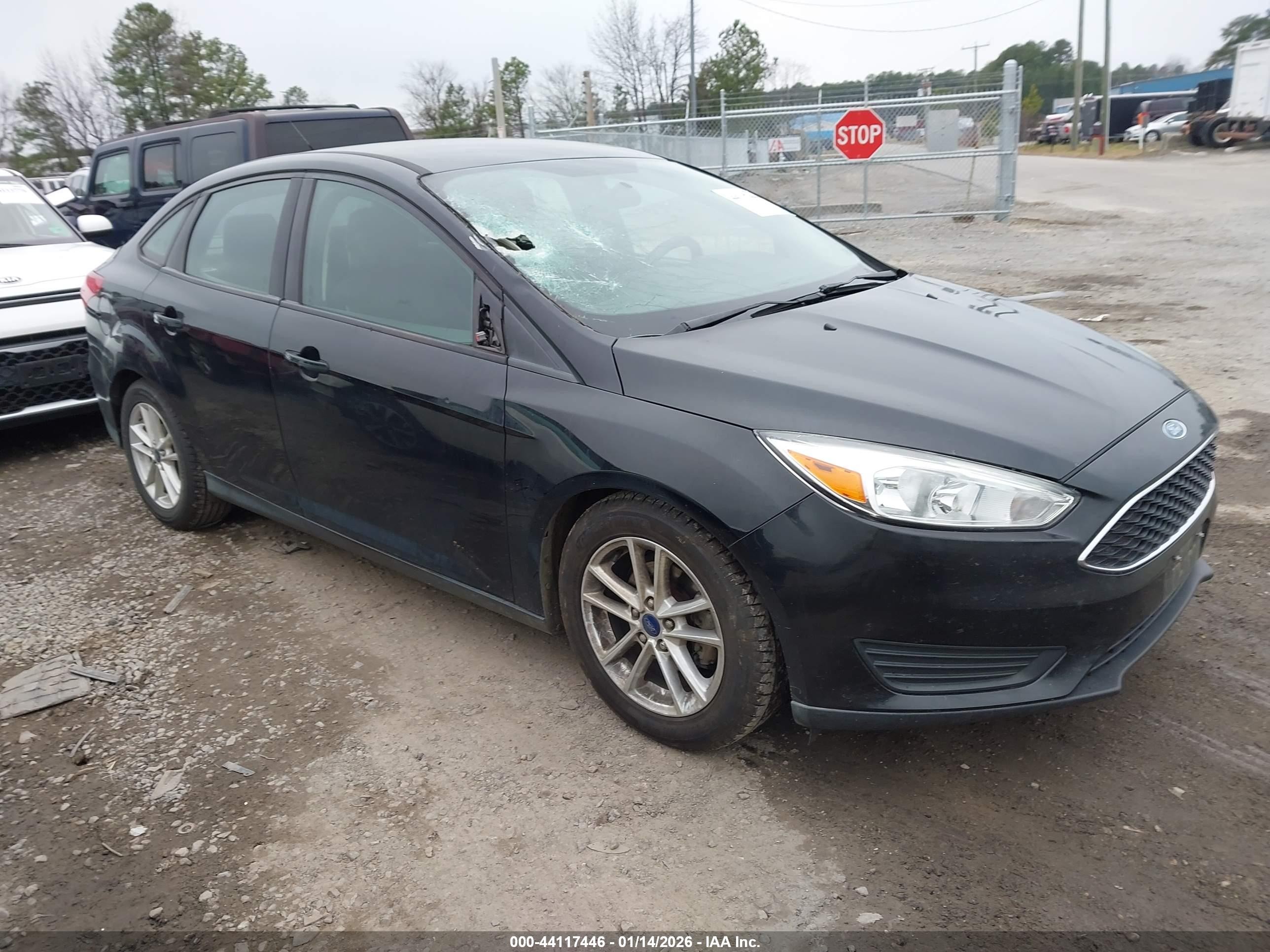 2016 Ford Focus SE, VIN 1FADP3F24GL371538 — Side