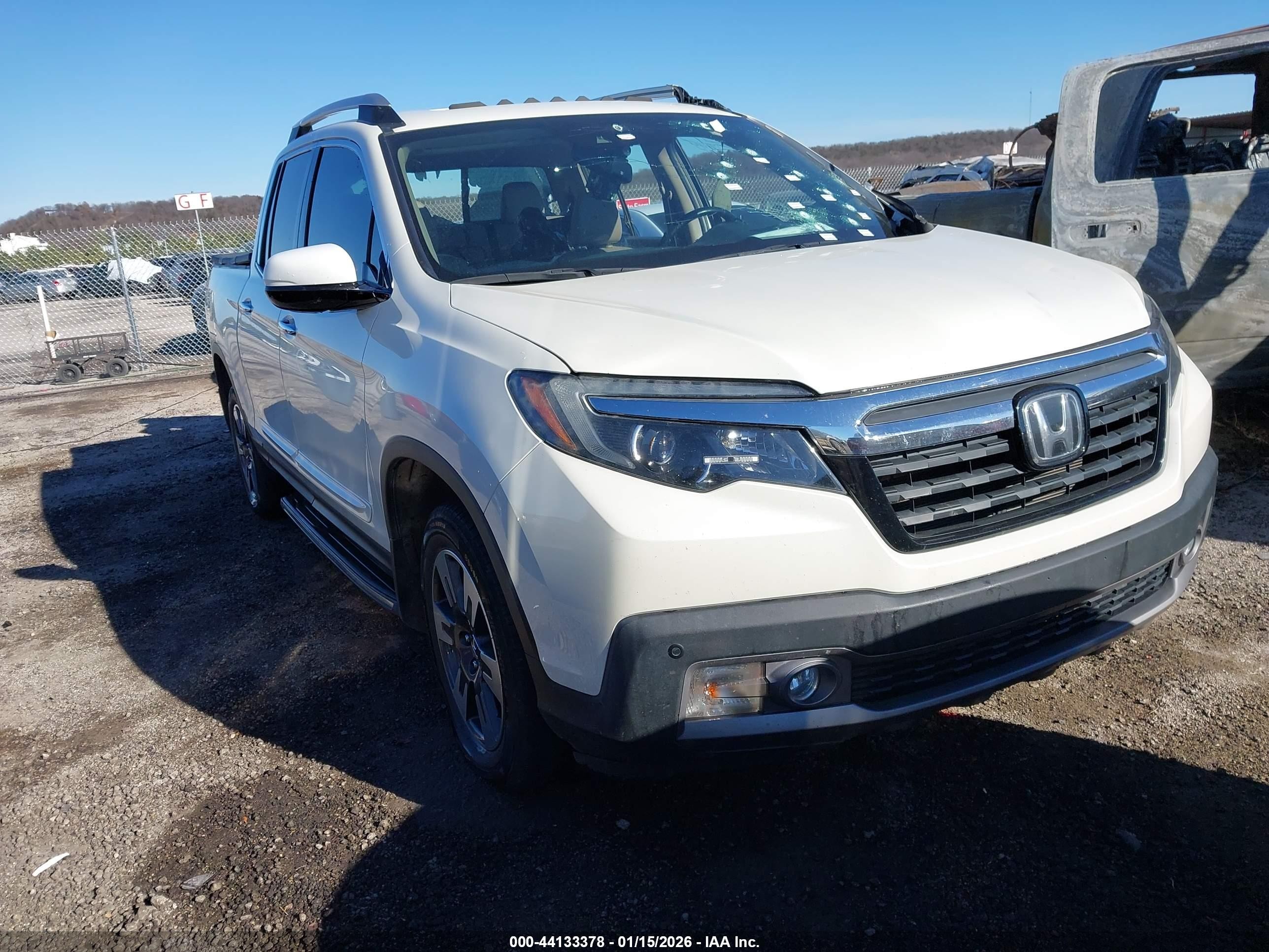2019 Honda Ridgeline RTL-E, VIN 5FPYK3F75KB003135 — Side