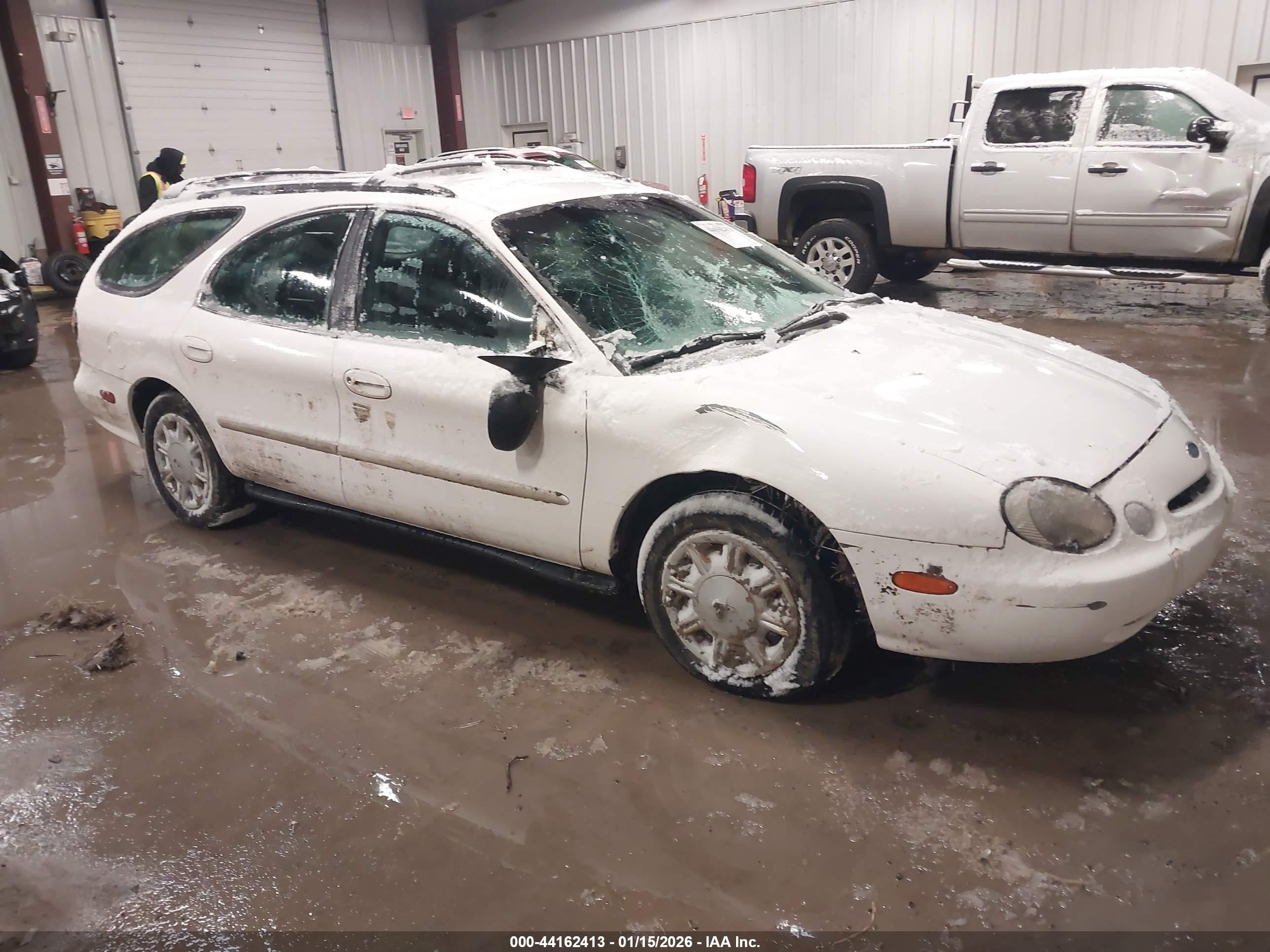 1996 Ford Taurus GL, VIN 1FALP57U0TA279372 — Side