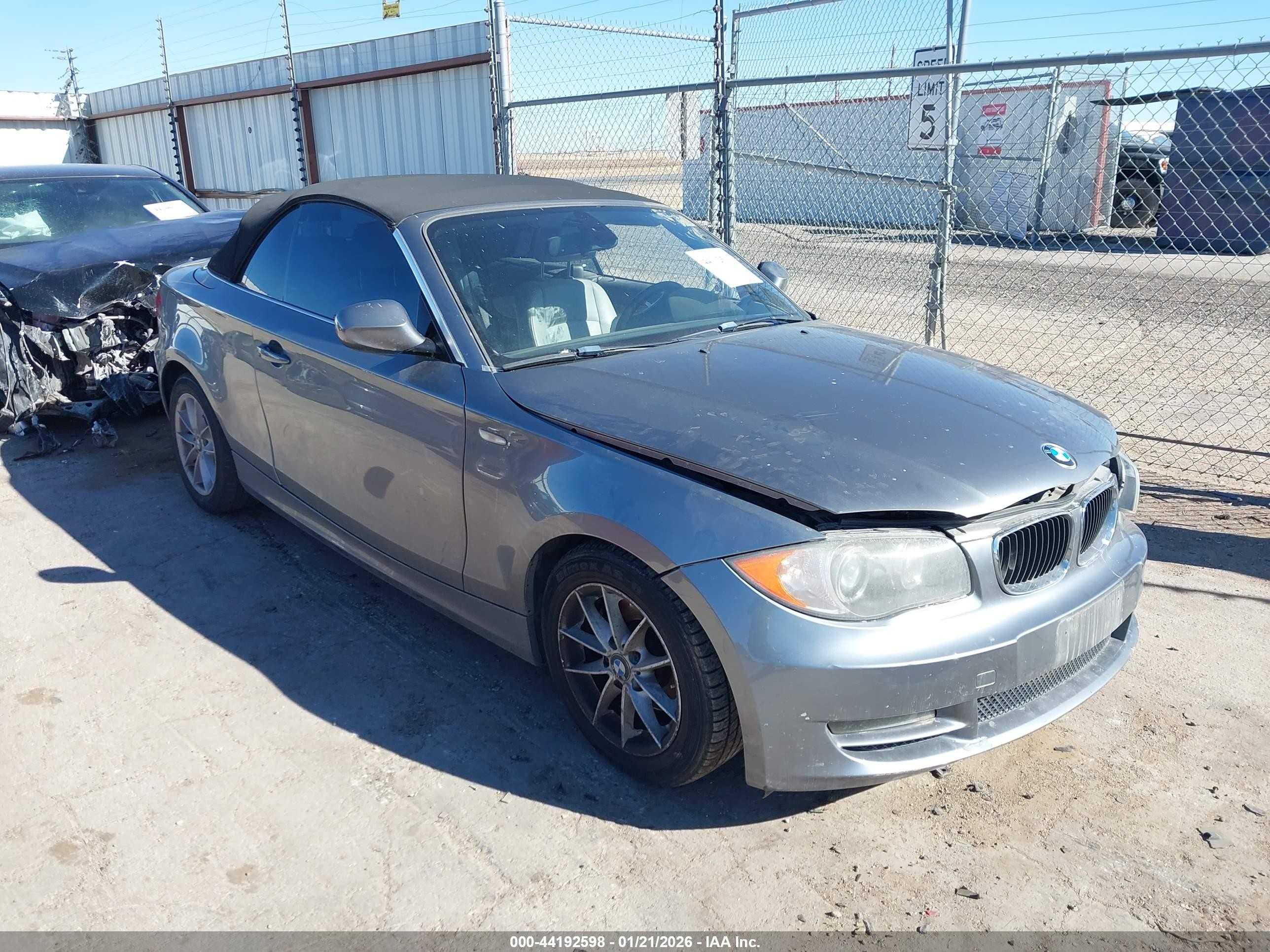 2011 BMW 1 Series 128i, VIN WBAUL7C53BVM80899 — Side