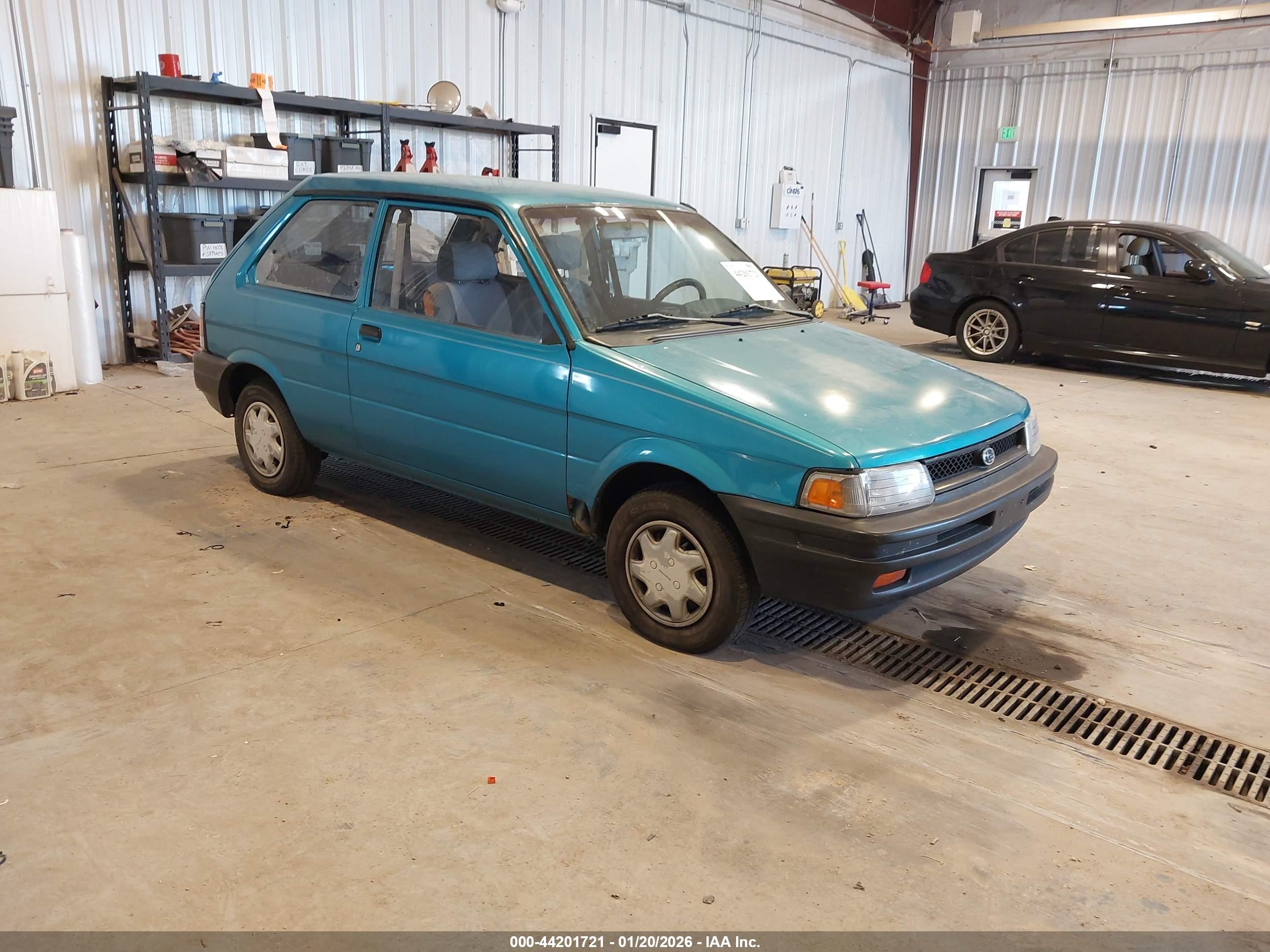 1994 Subaru Justy, VIN JF1KA7226RB702277 — Side