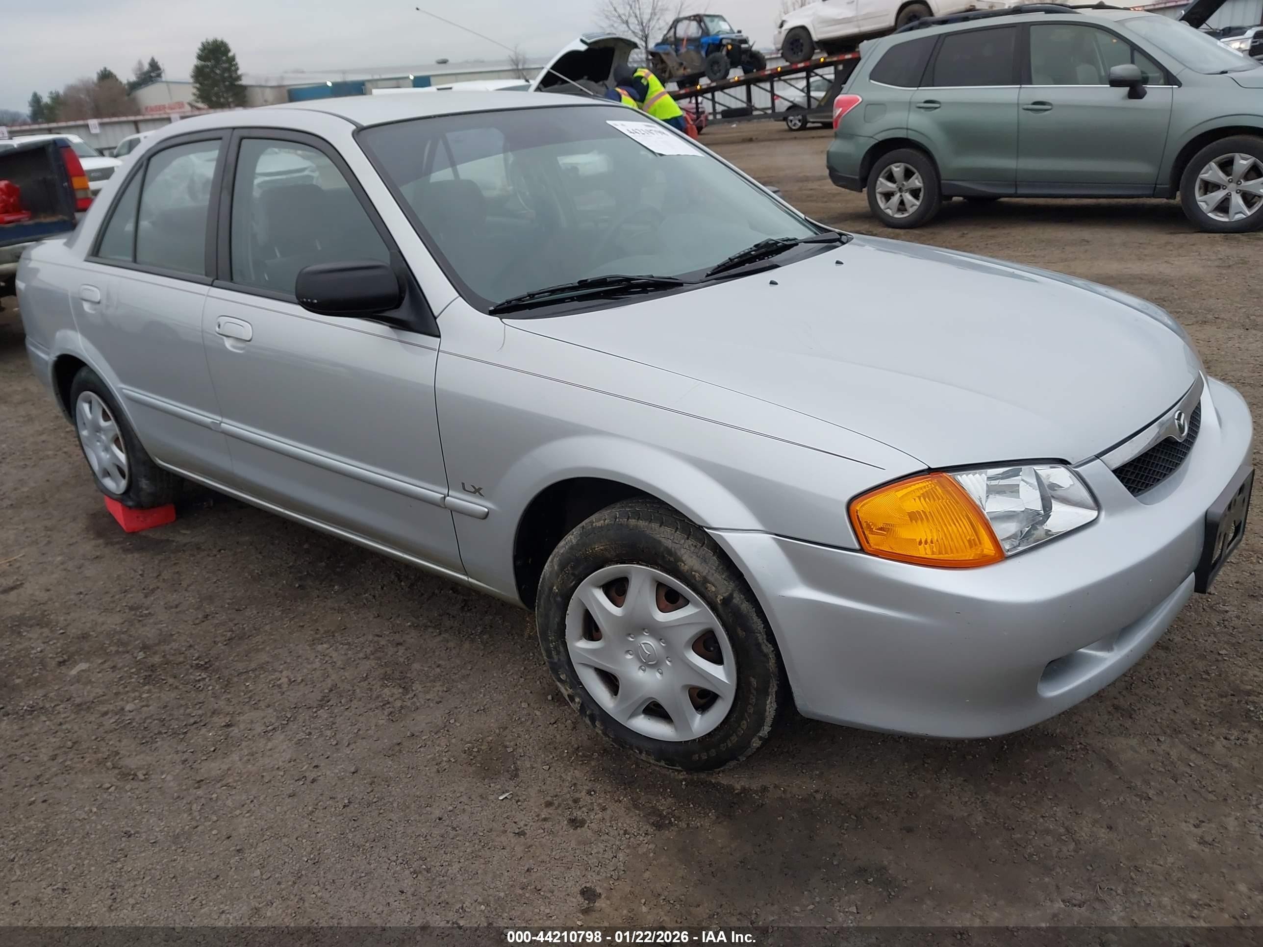 2000 Mazda Protege DX, VIN JM1BJ222XY0197075 — Side