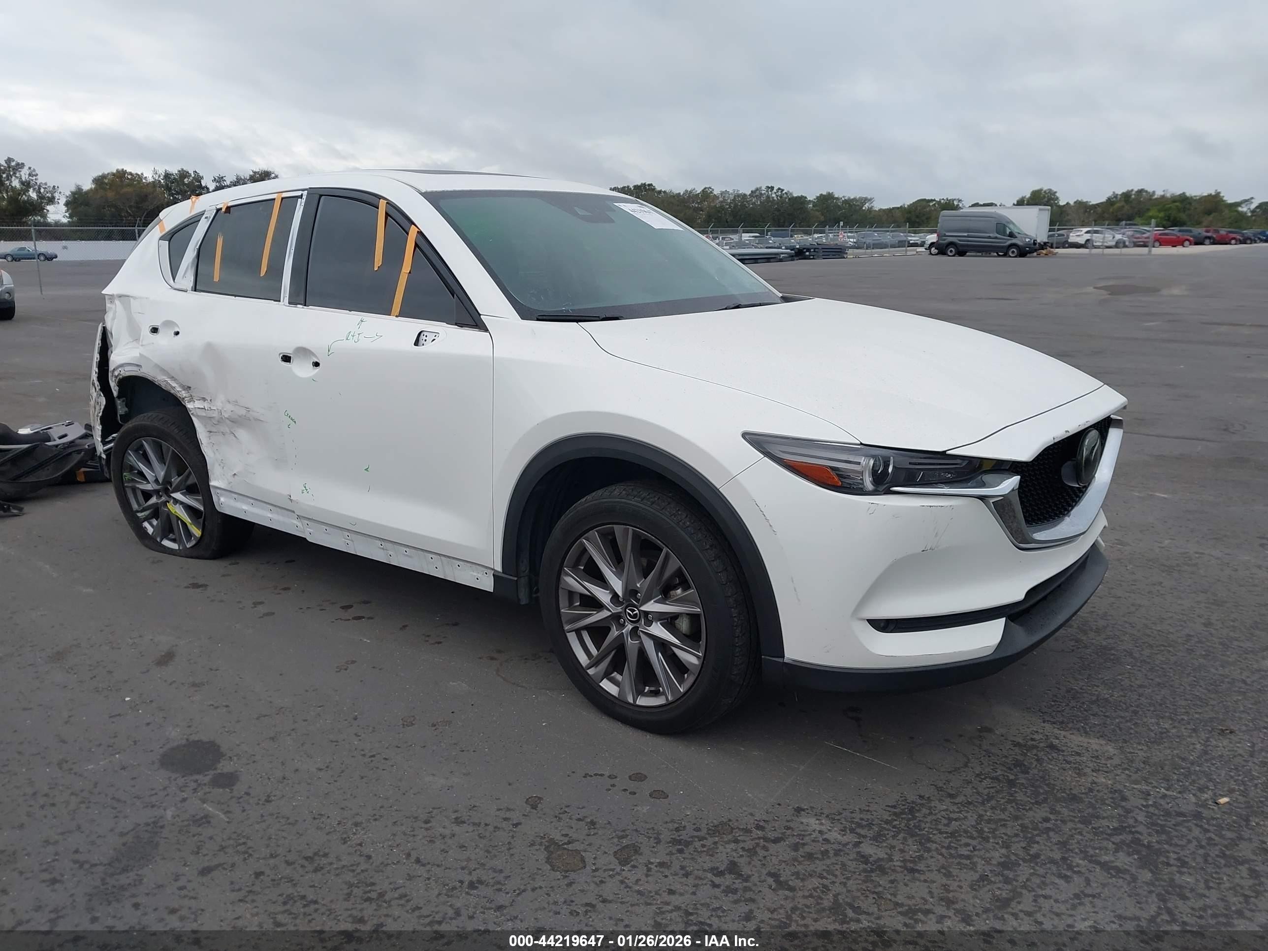 2021 Mazda CX-5 Grand Touring, VIN JM3KFBDM1M0469949 — Side
