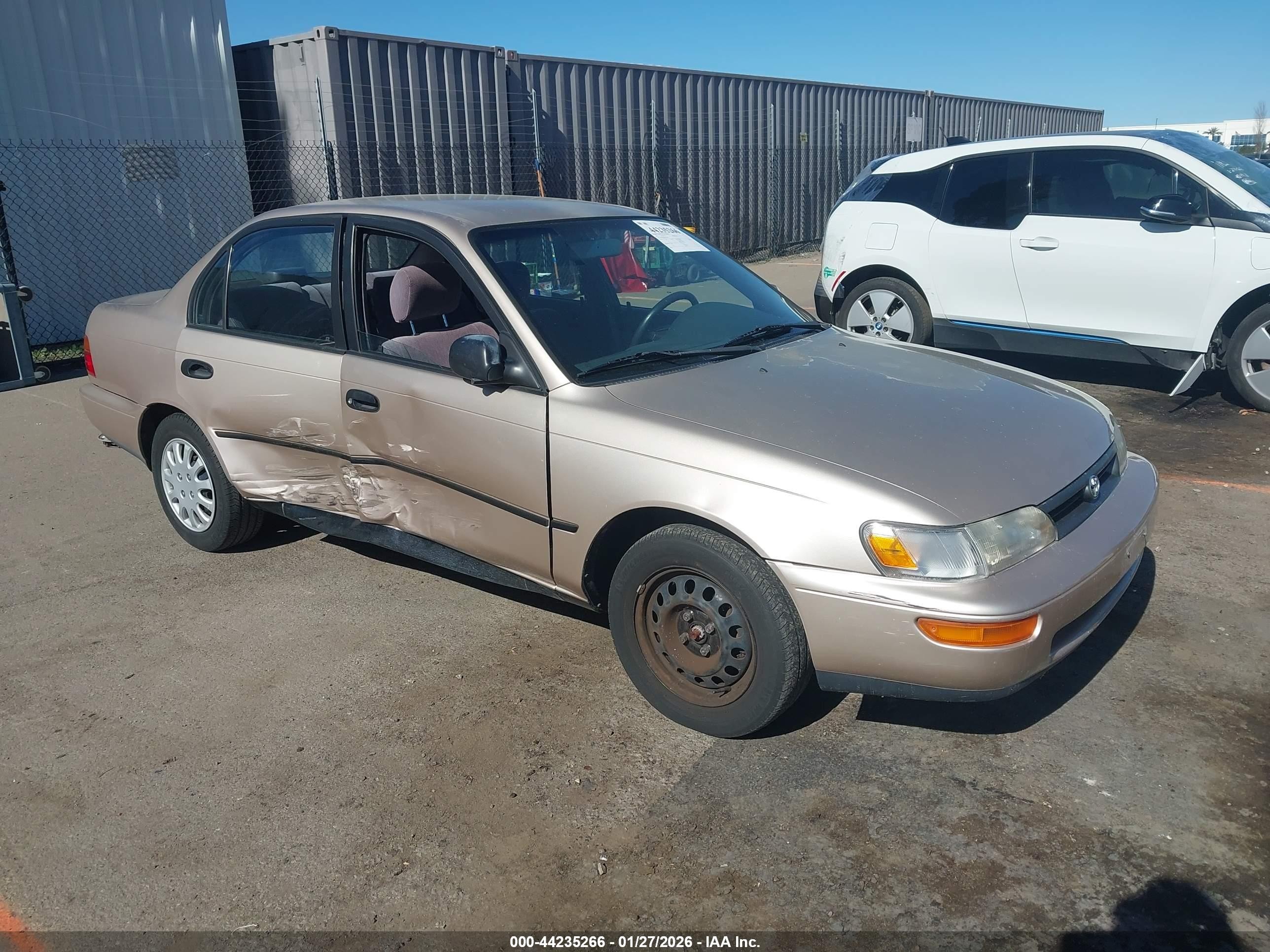 1995 Toyota Corolla DX, VIN 1NXAE09B0SZ295246 — Side