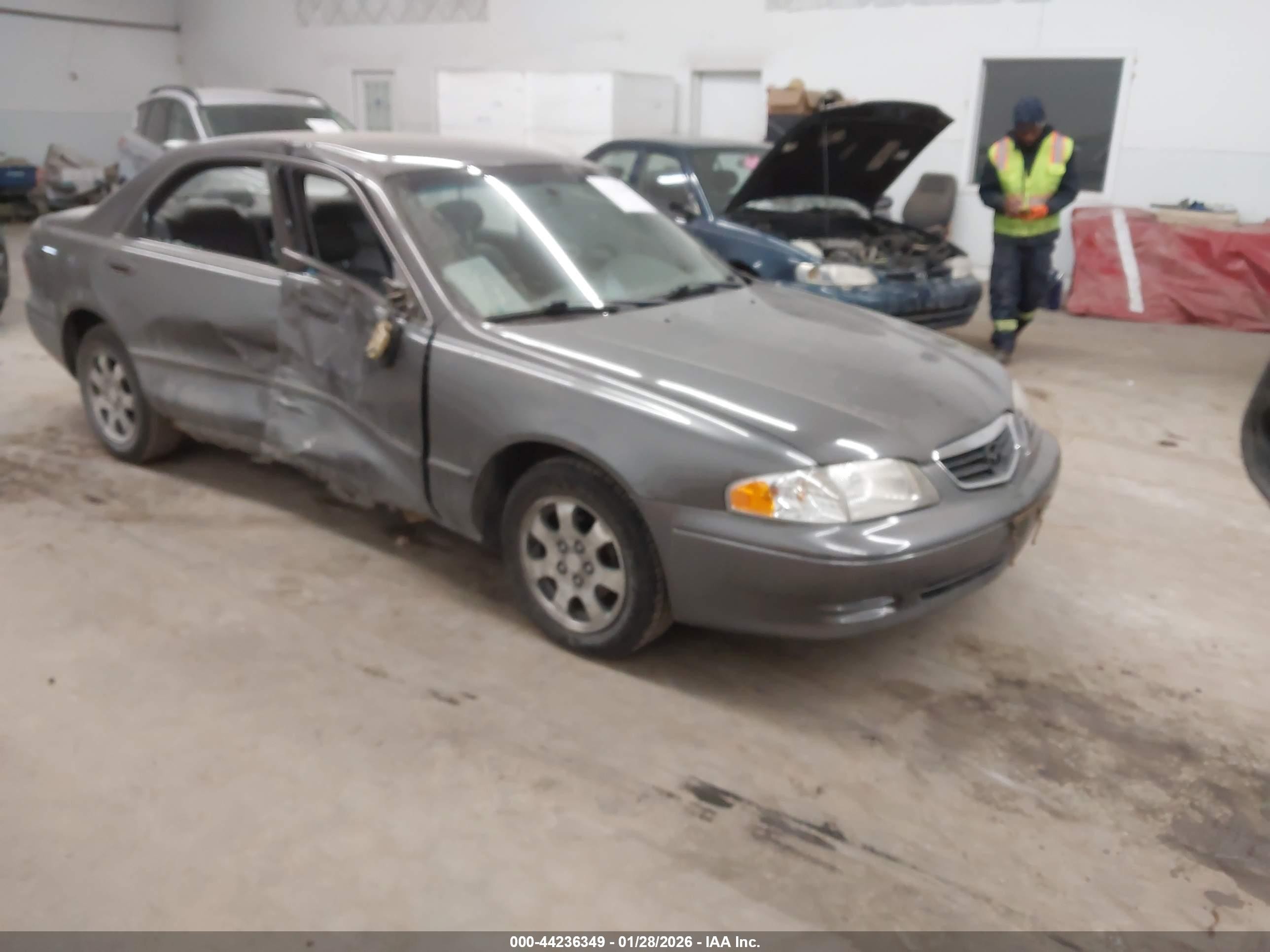 2000 Mazda 626 LX, VIN 1YVGF22C9Y5105113 — Side