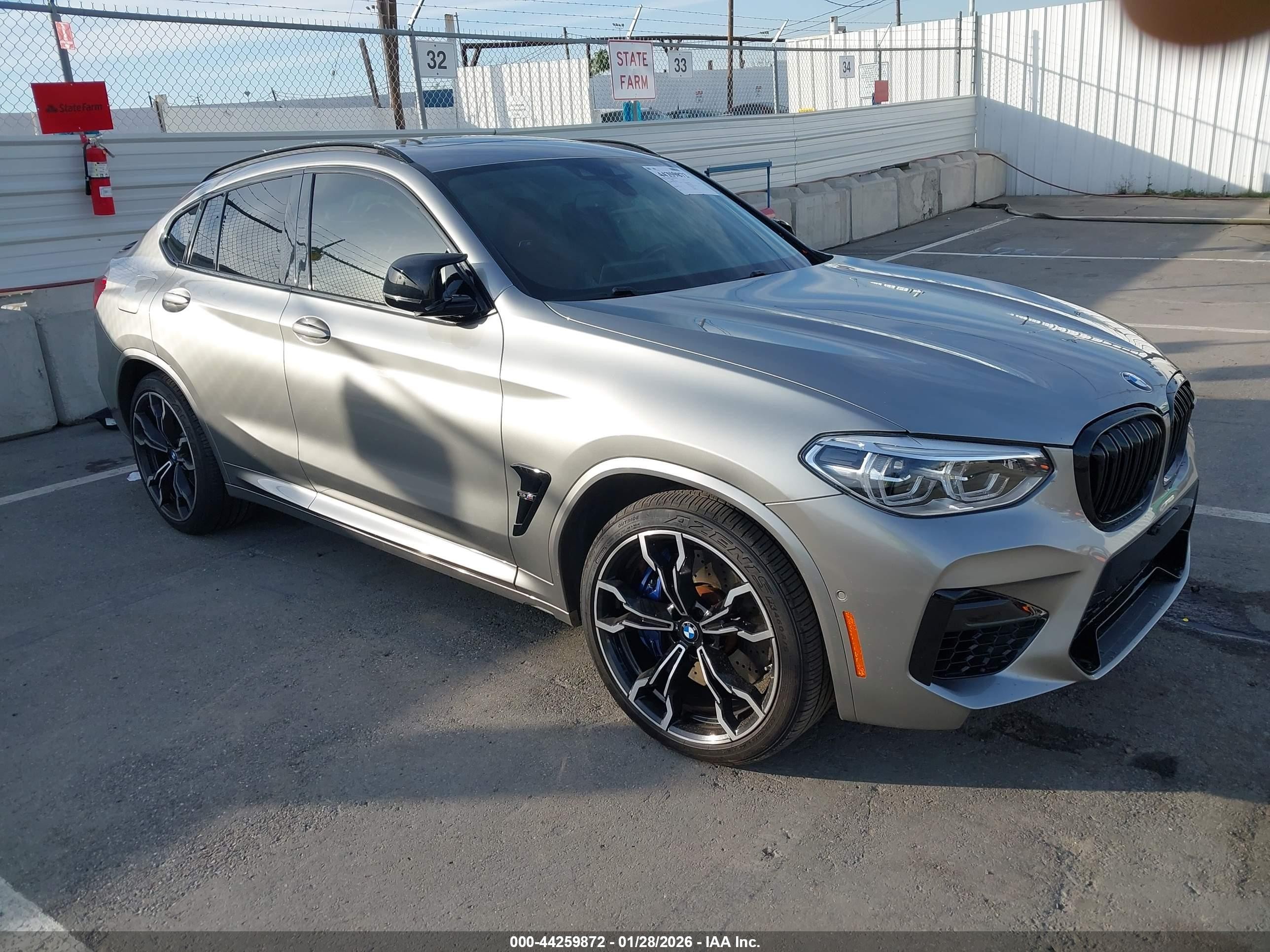 2021 BMW X4 M, VIN 5YMUJ0C04M9D00744 — Side