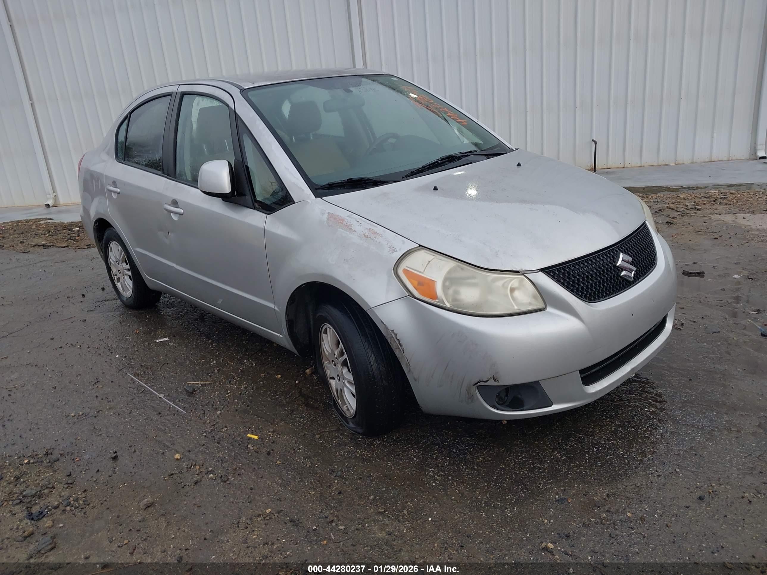 2012 Suzuki SX4 LE, VIN JS2YC5A38C6303857 — Side