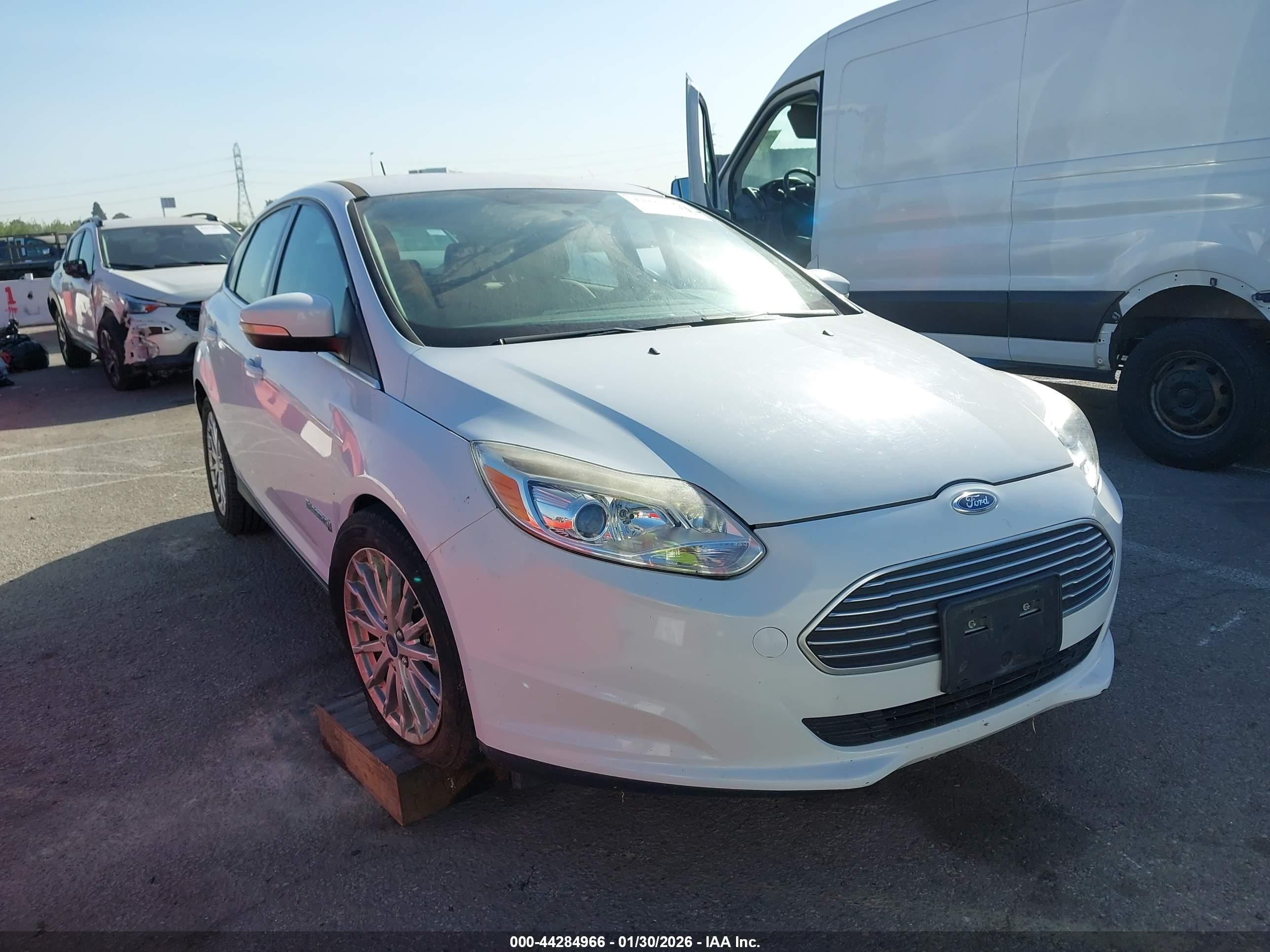 2016 Ford Focus Electric, VIN 1FADP3R4XGL380788 — Side