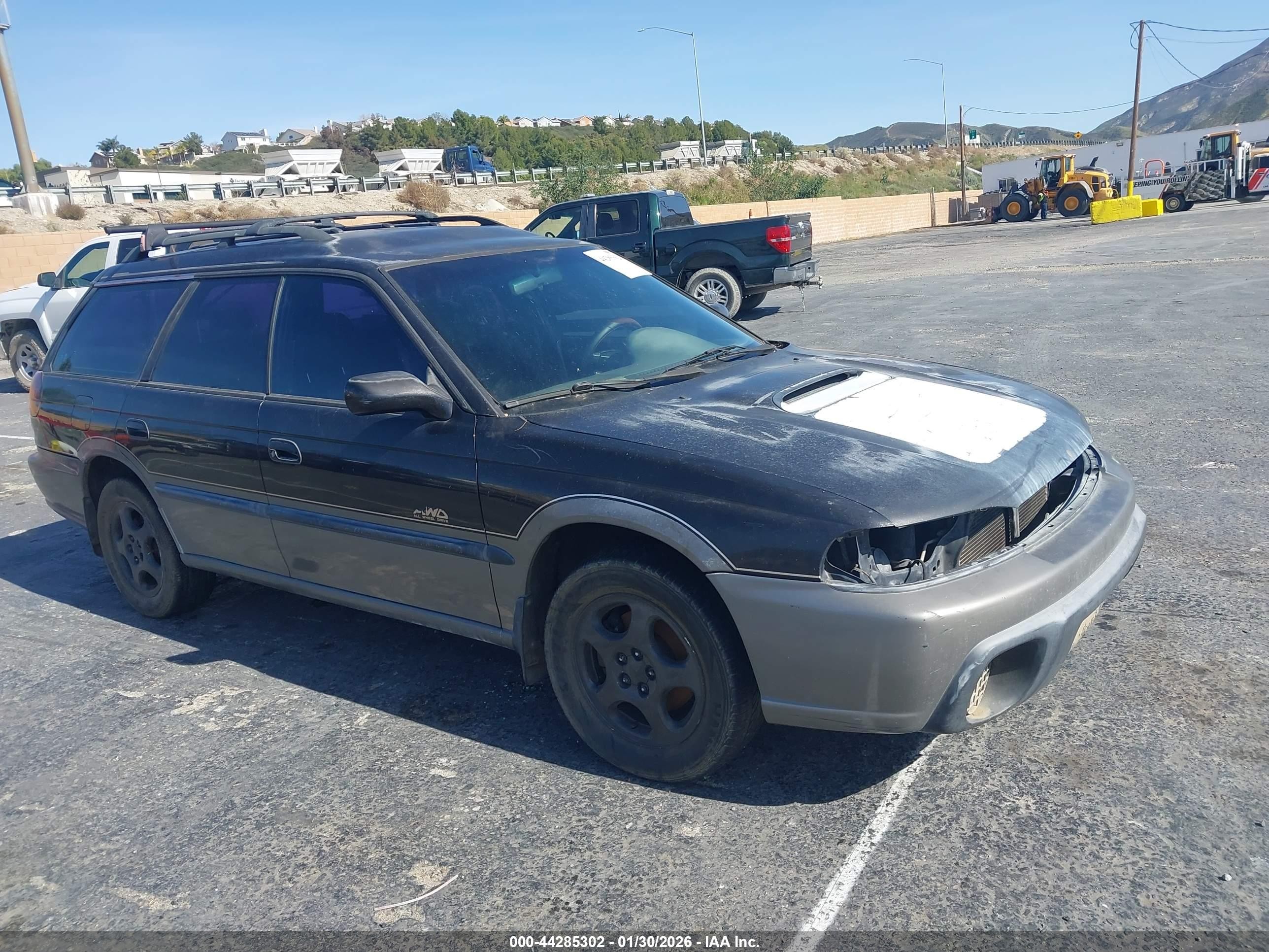 1997 Subaru Legacy Outback, VIN 4S3BG6859V6630482 — Бок