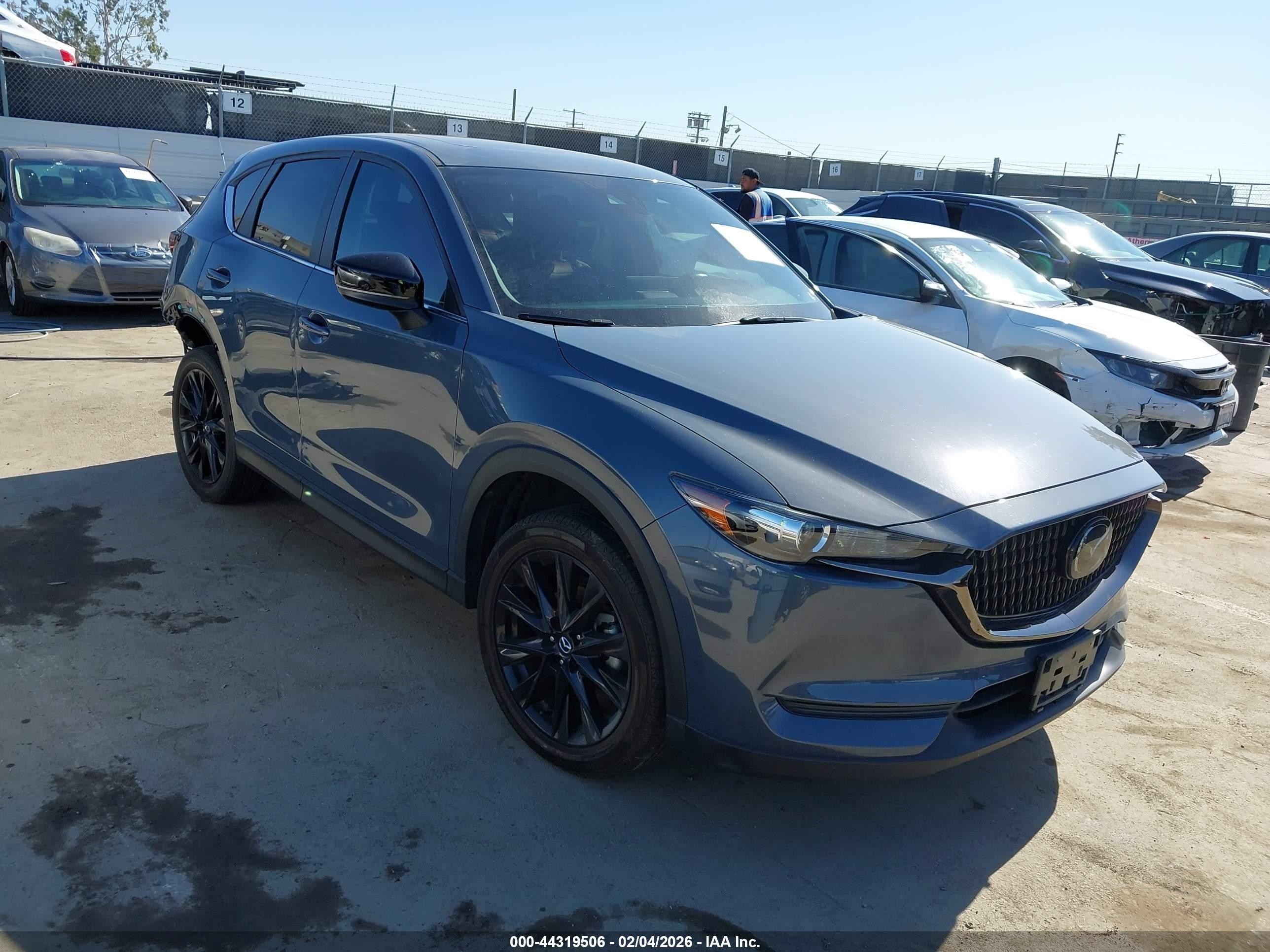 2021 Mazda CX-5 Touring, VIN JM3KFACM5M0331200 — Rear end