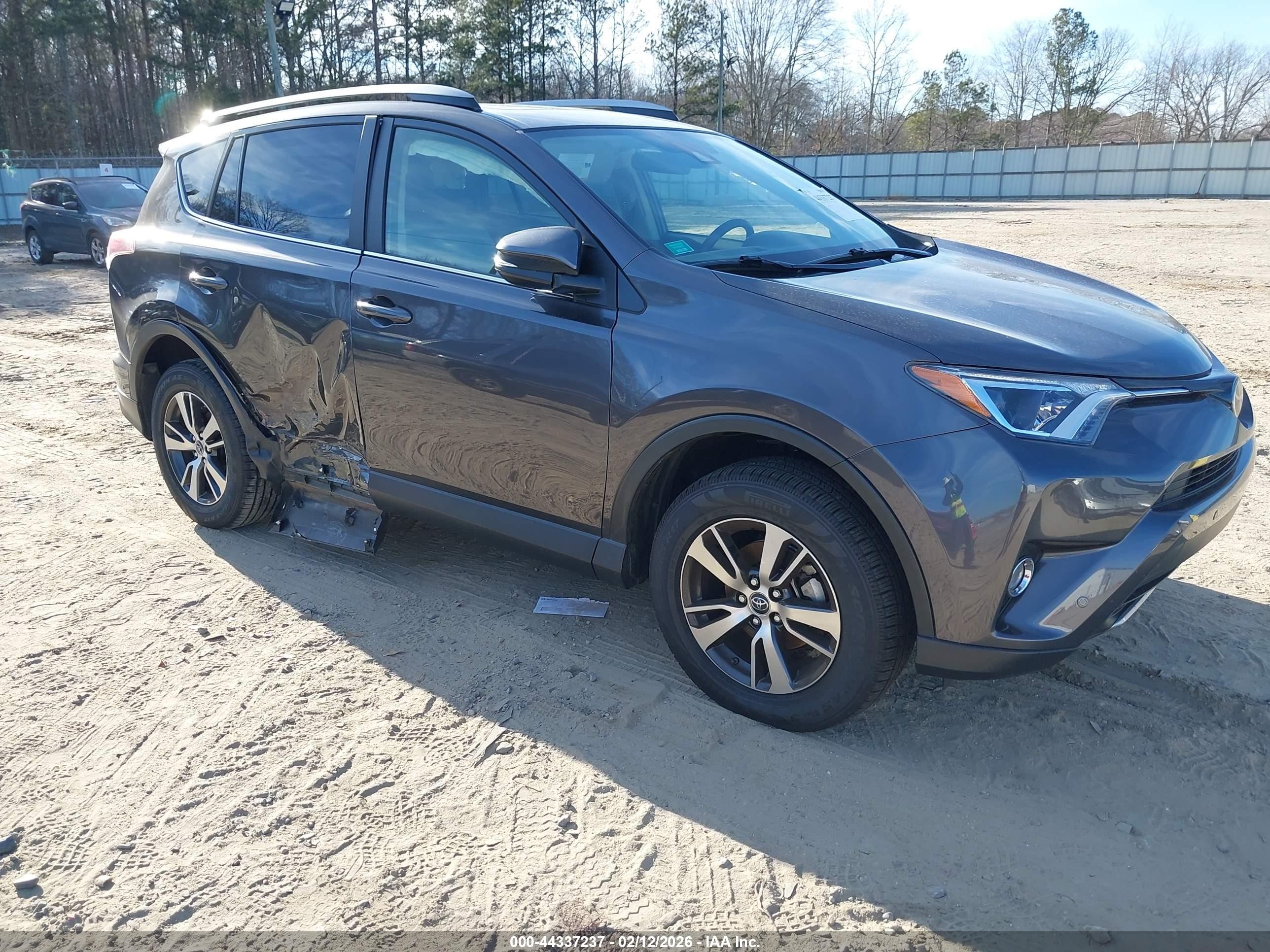 2017 Toyota RAV4 XLE, VIN JTMWFREV6HJ706087 — Side