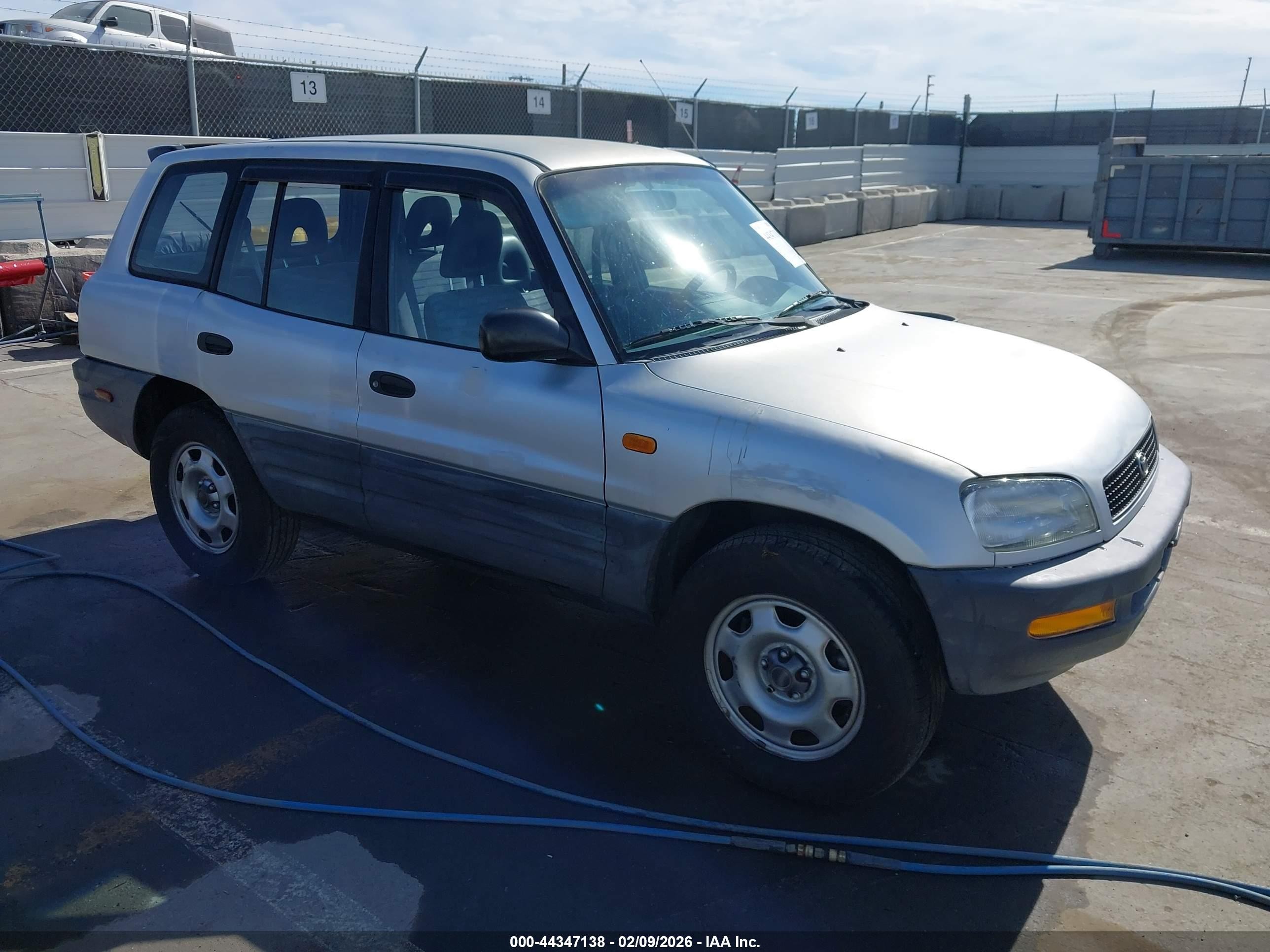 1997 Toyota RAV4, VIN JT3GP10V3V0010903 — Side