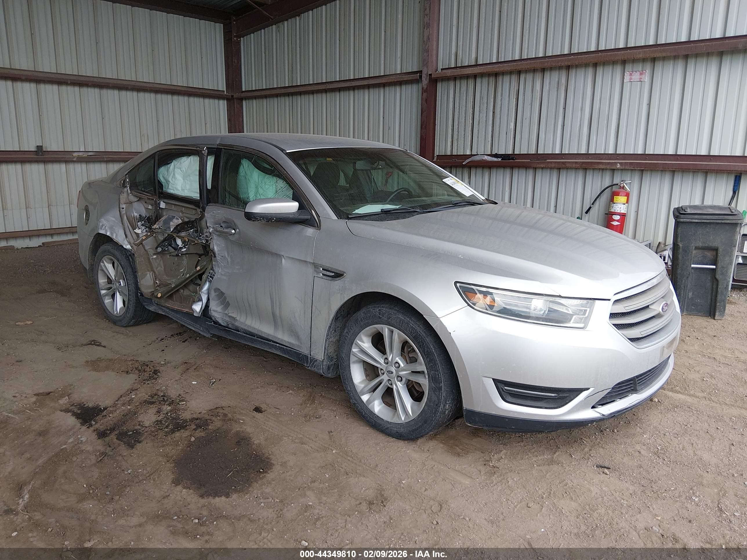 2015 Ford Taurus SEL, VIN 1FAHP2E82FG153669 — Side