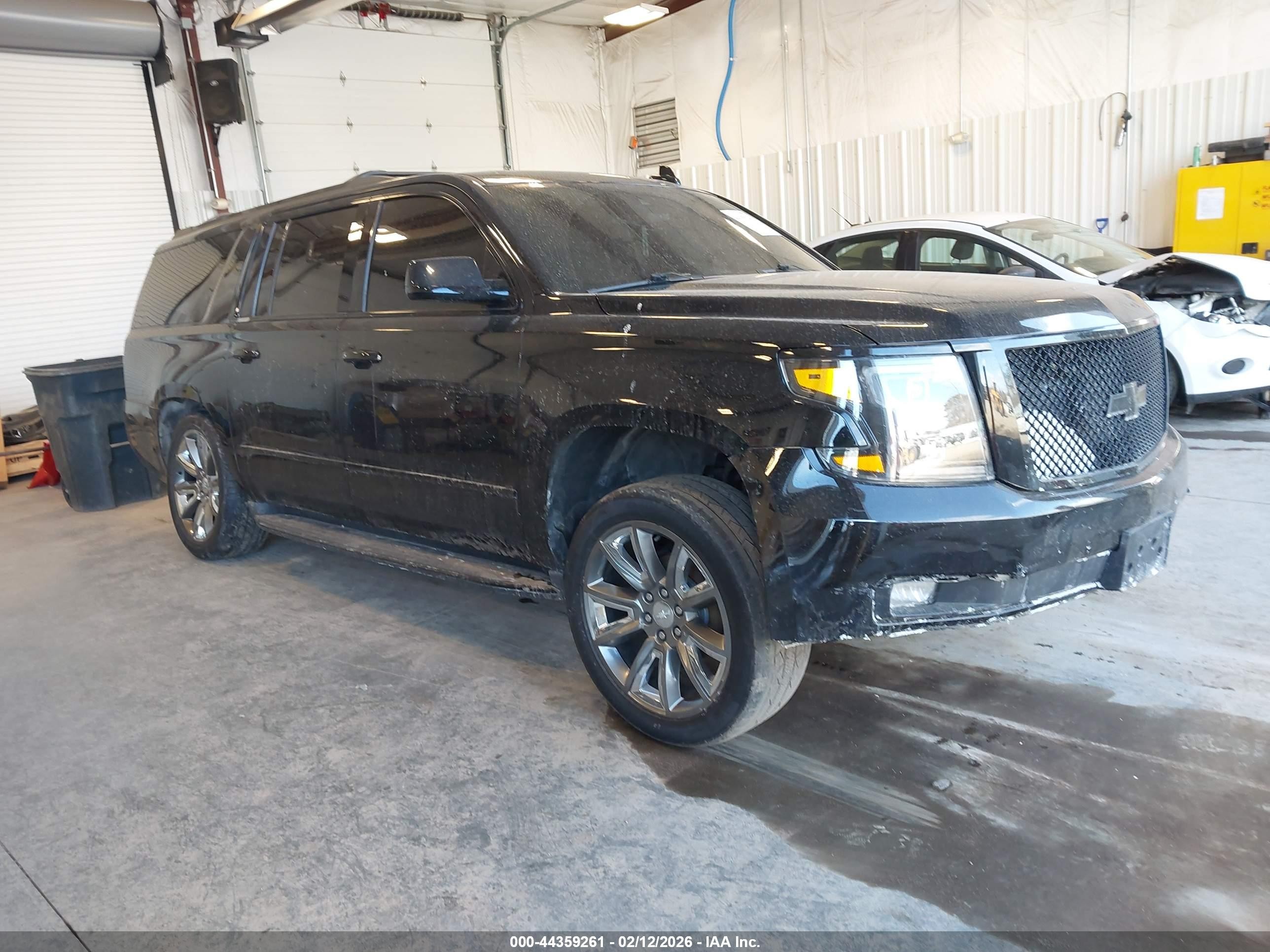 2018 Chevrolet Suburban Premier, VIN 1GNSKJKC2JR260405 — Side