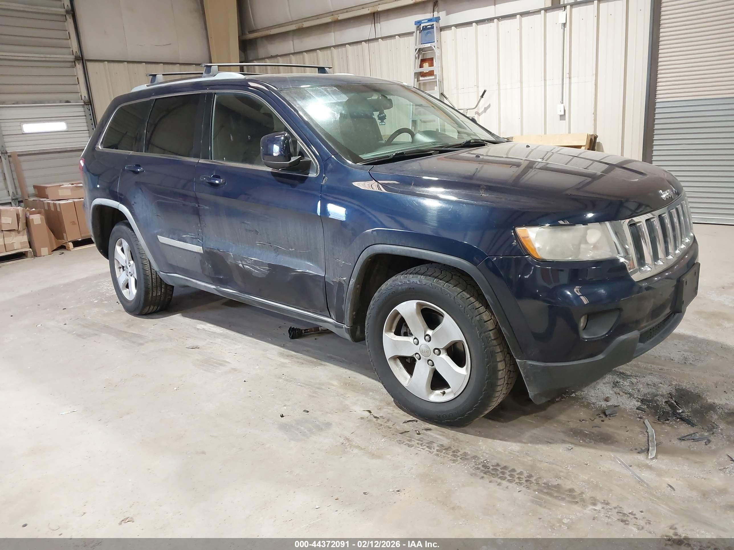 2012 Jeep Grand Cherokee Laredo, VIN 1C4RJFAG6CC160387 — Бок