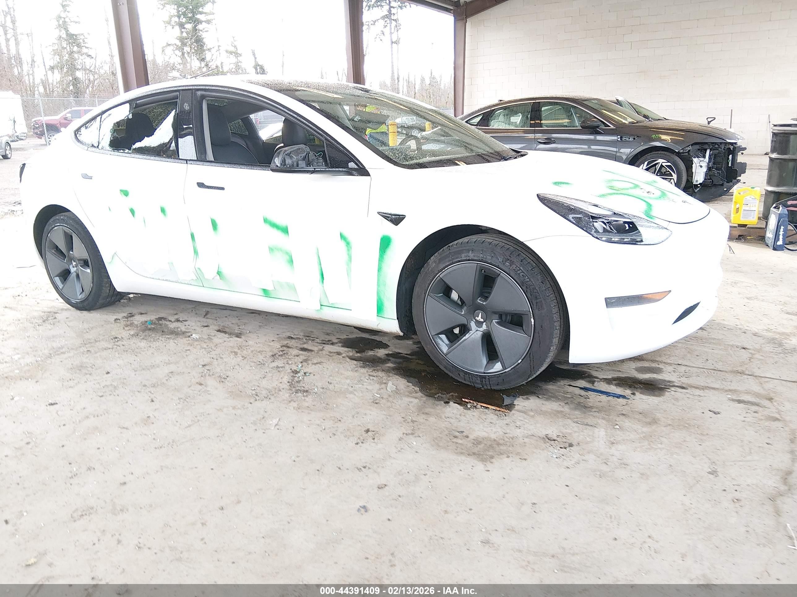 2021 Tesla Model 3 Standard Range Plus, VIN 5YJ3E1EA3MF976867 — Vandalism