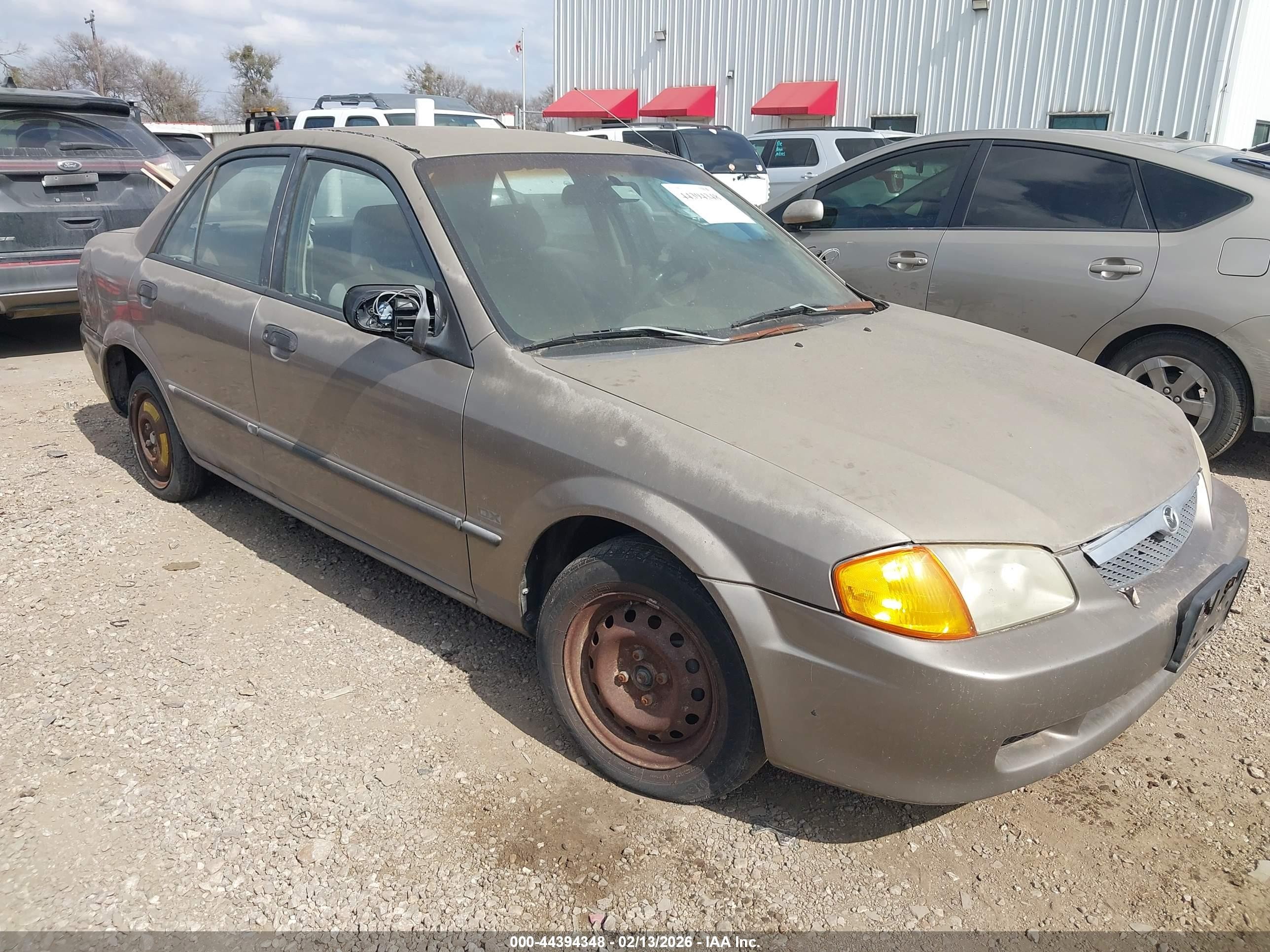 1999 Mazda Protege DX, VIN JM1BJ2225X0122590 — Зад