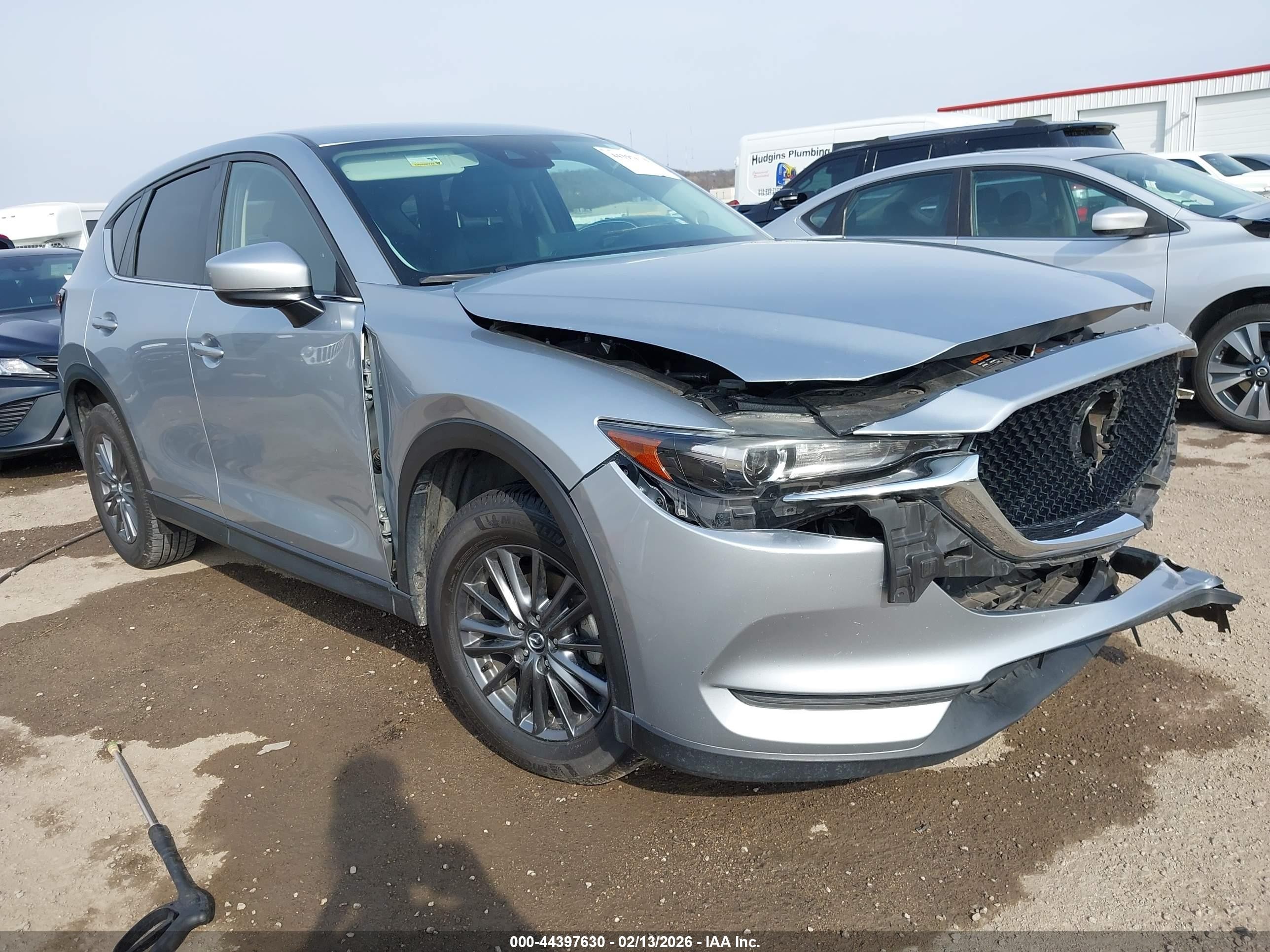 2021 Mazda CX-5 Carbon Edition, VIN JM3KFACM4M0340311 — Side