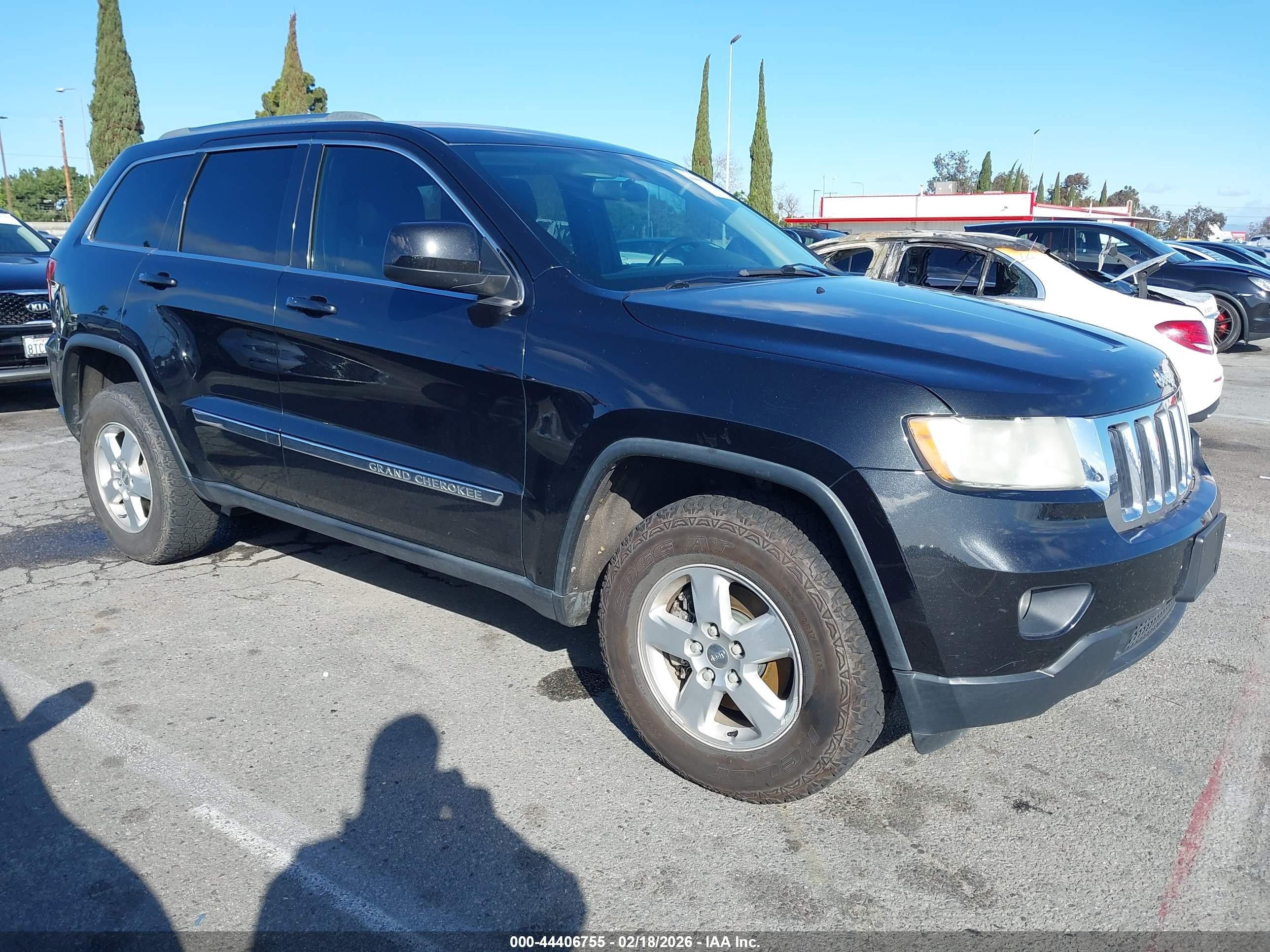 2013 Jeep Grand Cherokee Laredo, VIN 1C4RJFAG9DC560154 — Side