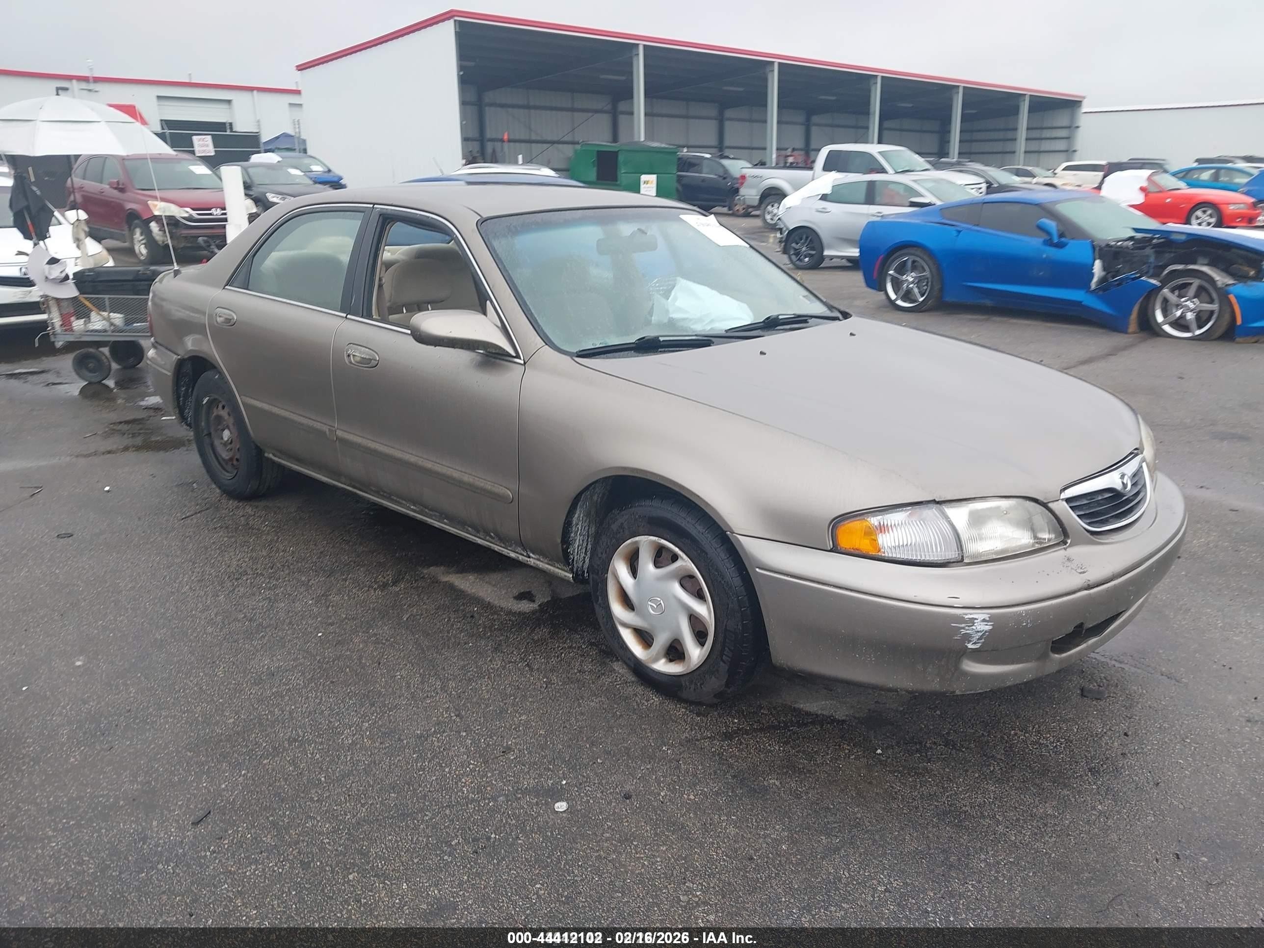 1998 Mazda 626 DX, VIN 1YVGF22CXW5736434 — Side