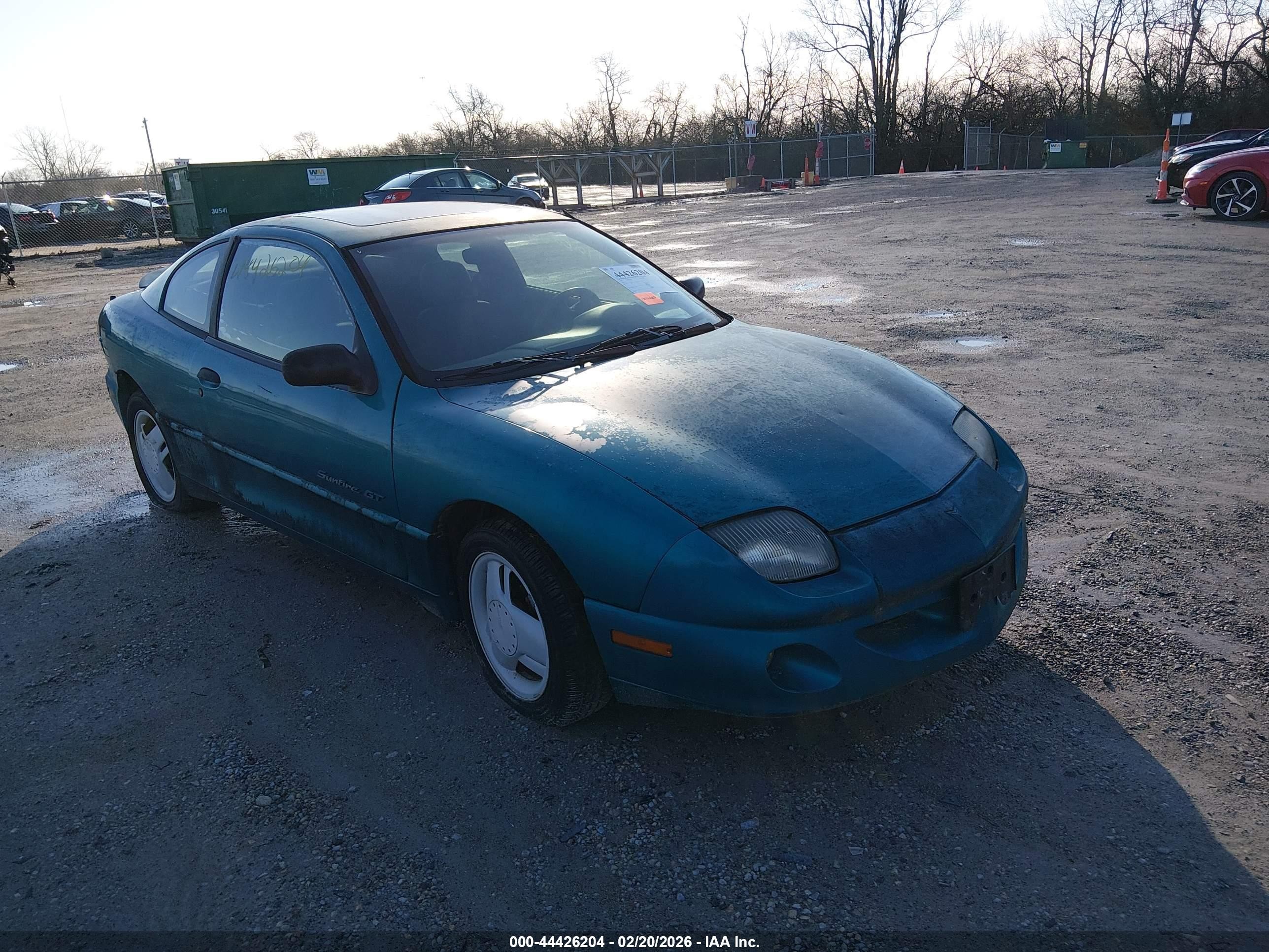 1997 Pontiac Sunfire, VIN 1G2JD12T5V7534989 — Side