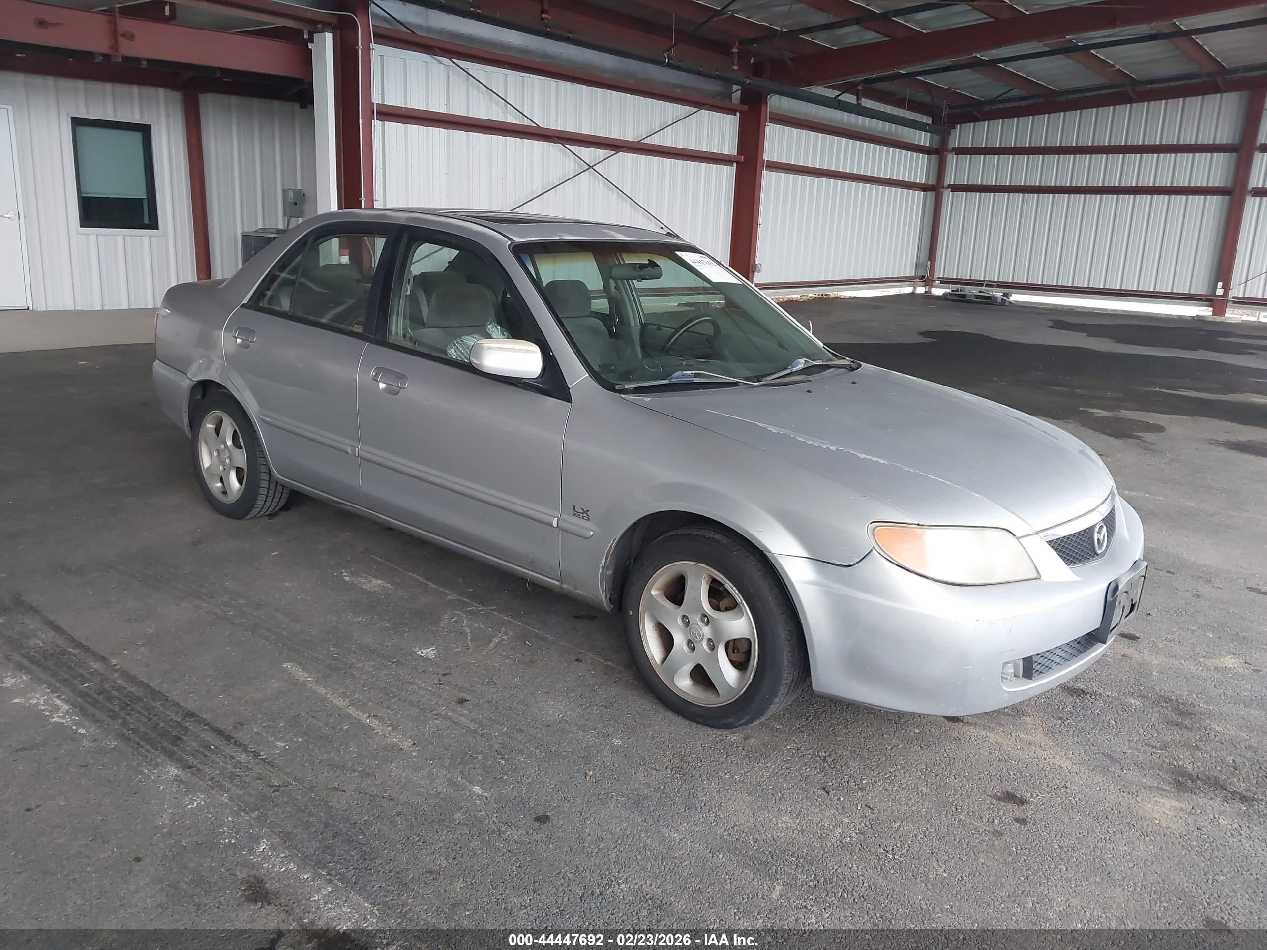 2001 Mazda Protege LX, VIN JM1BJ225210474852 — Бок