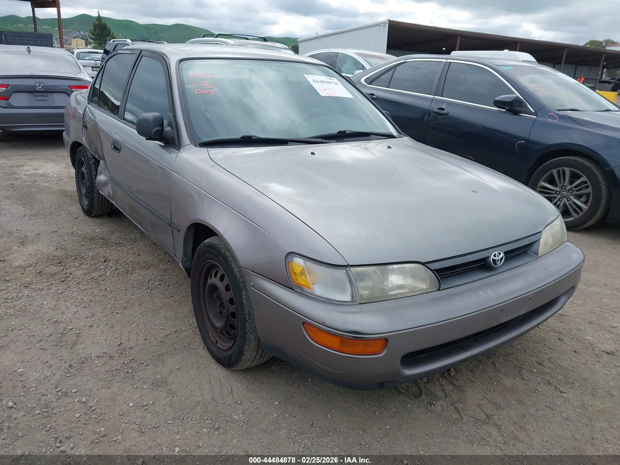 1995 Toyota Corolla DX, VIN 1NXAE09B7SZ284731 — Side