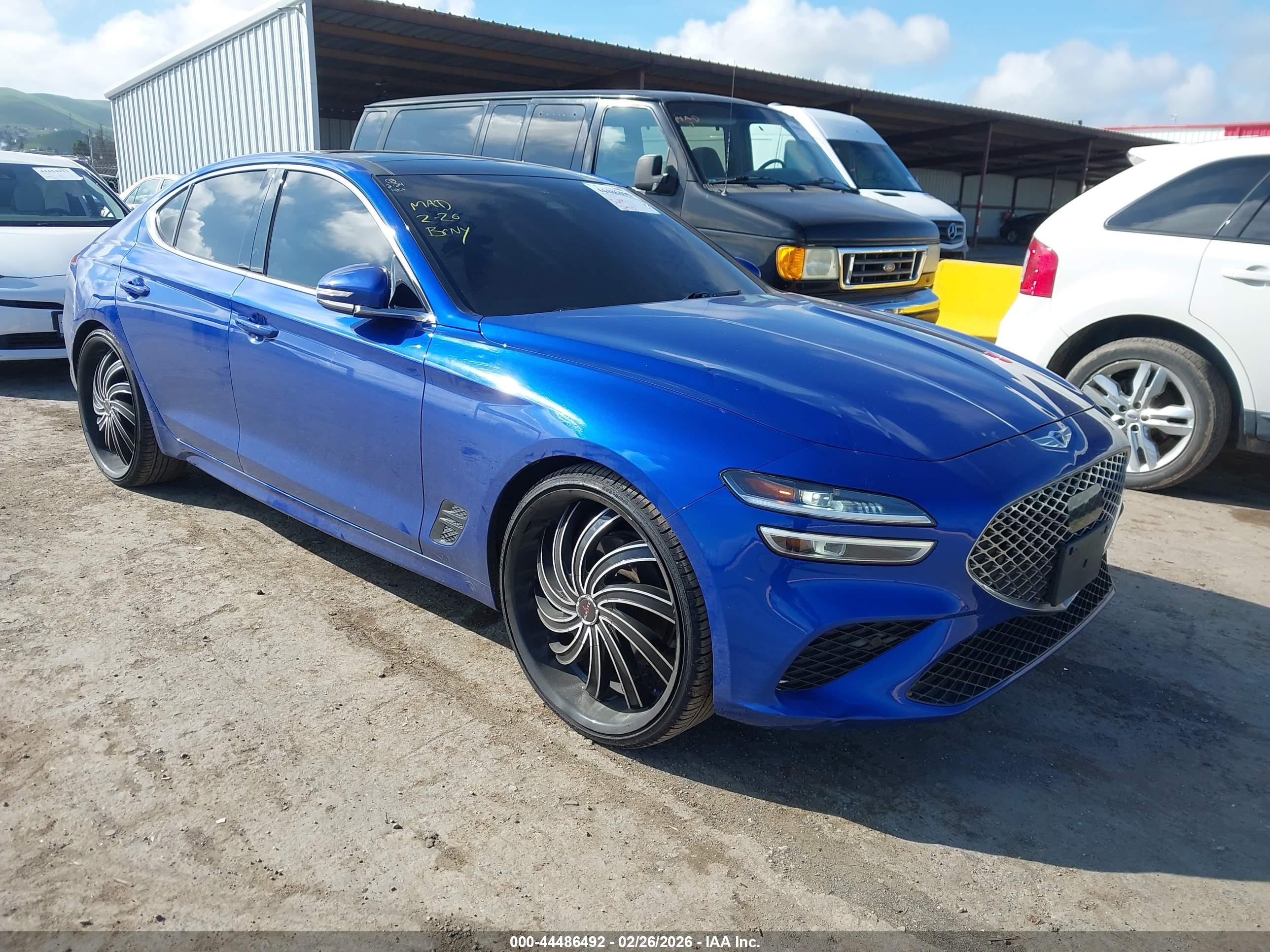 2022 Genesis G70 2.0T, VIN KMTG34TA9NU098724 — Side