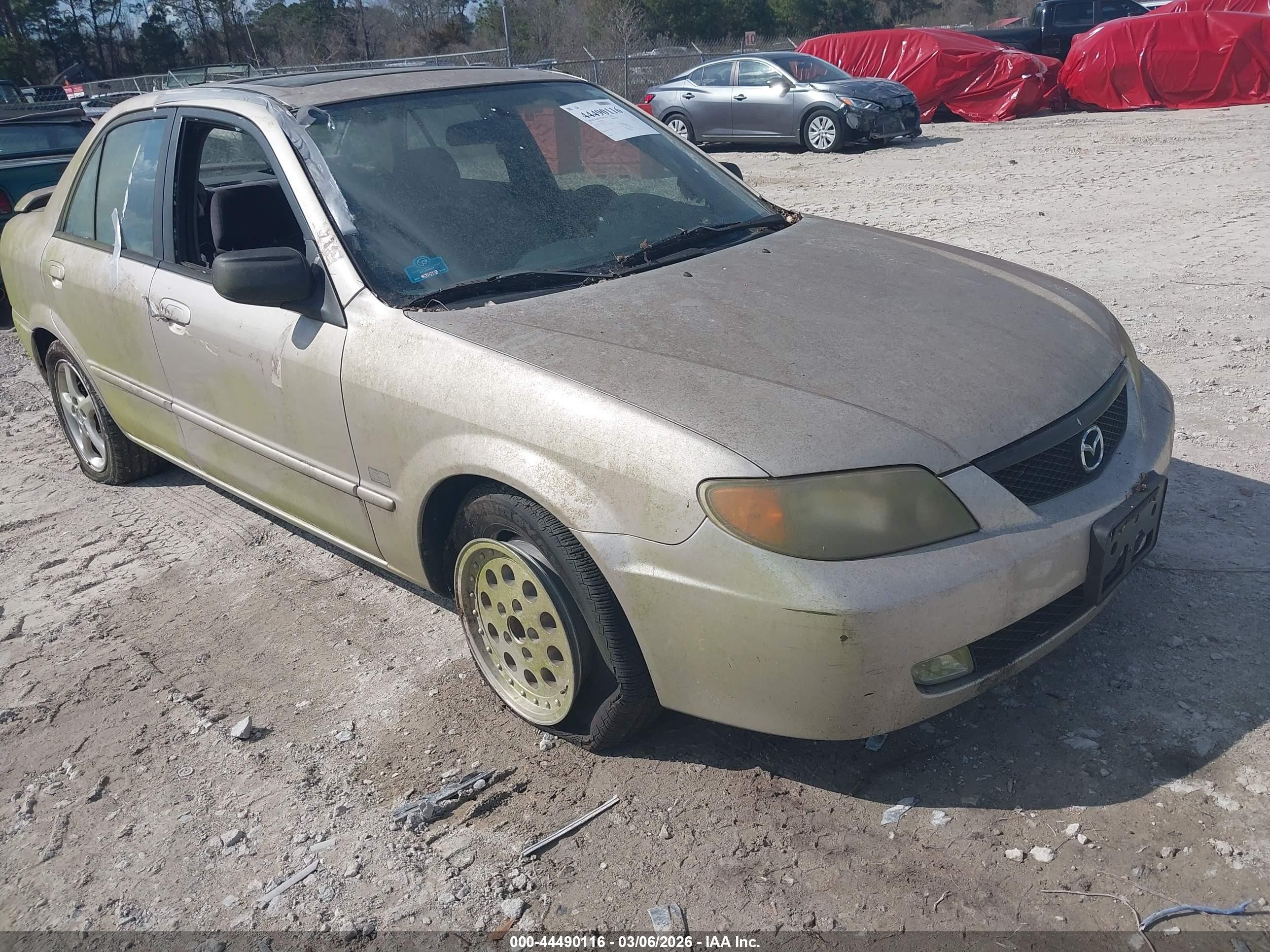 2001 Mazda Protege LX, VIN JM1BJ226X10423530 — Обычный износ