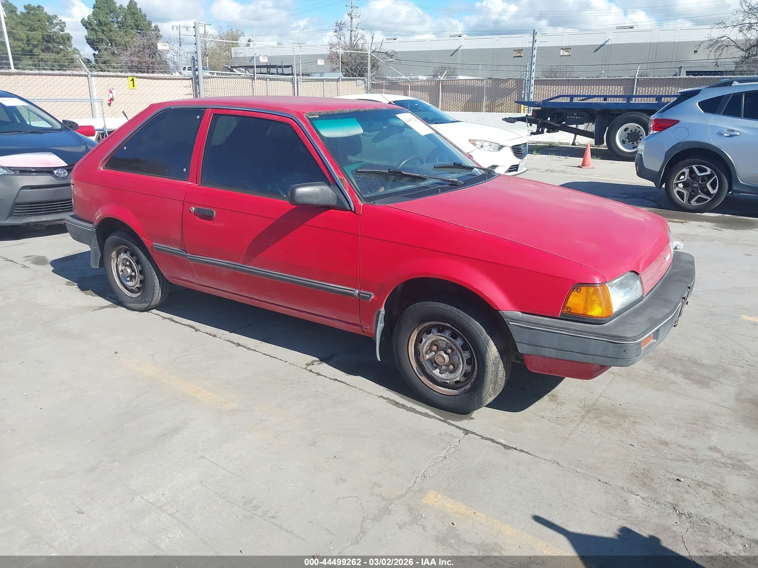 1989 Mazda 323, VIN JM1BF2327K0369182 — Rear end