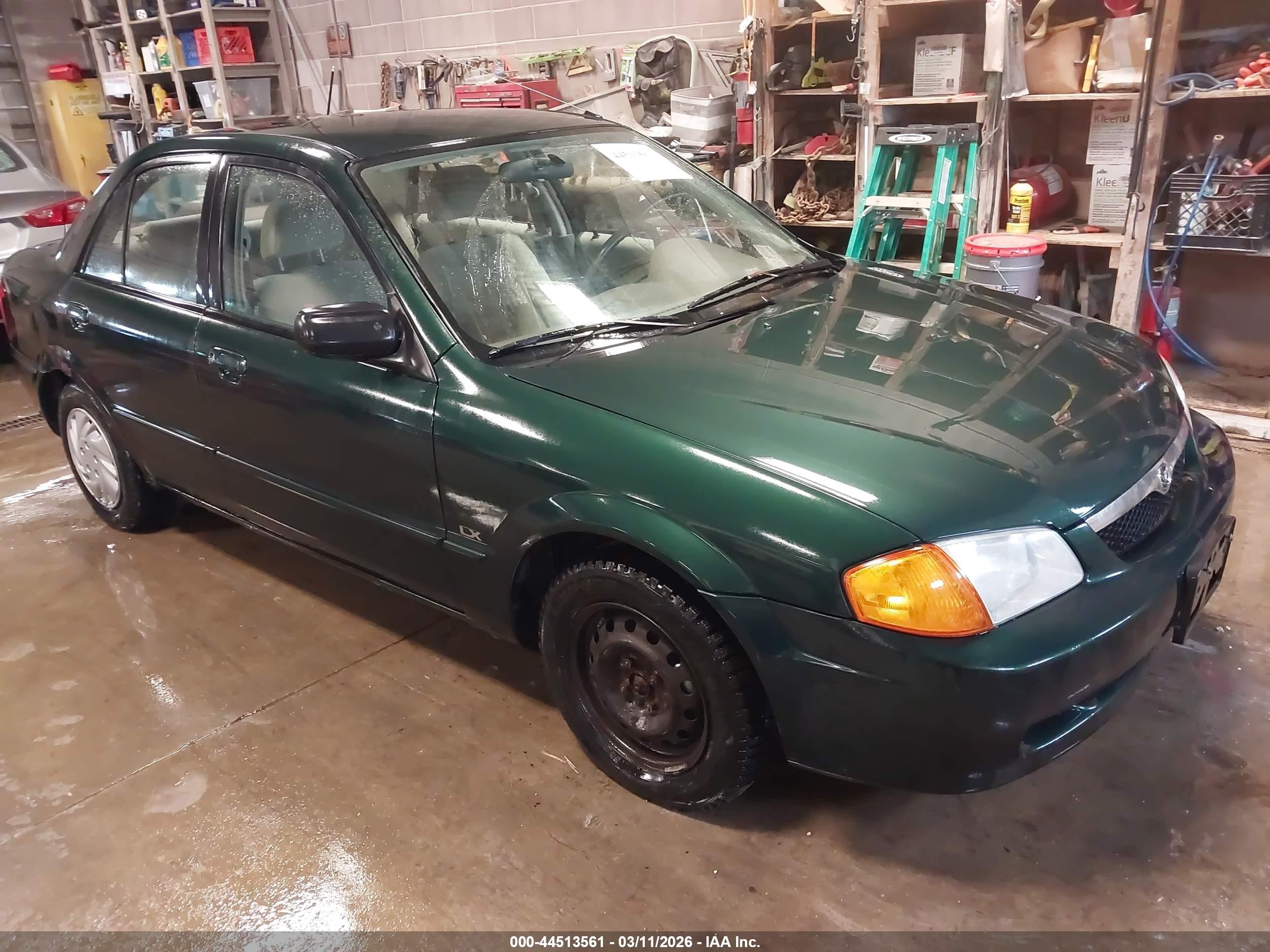 1999 Mazda Protege DX, VIN JM1BJ2225X0165892 — Бок