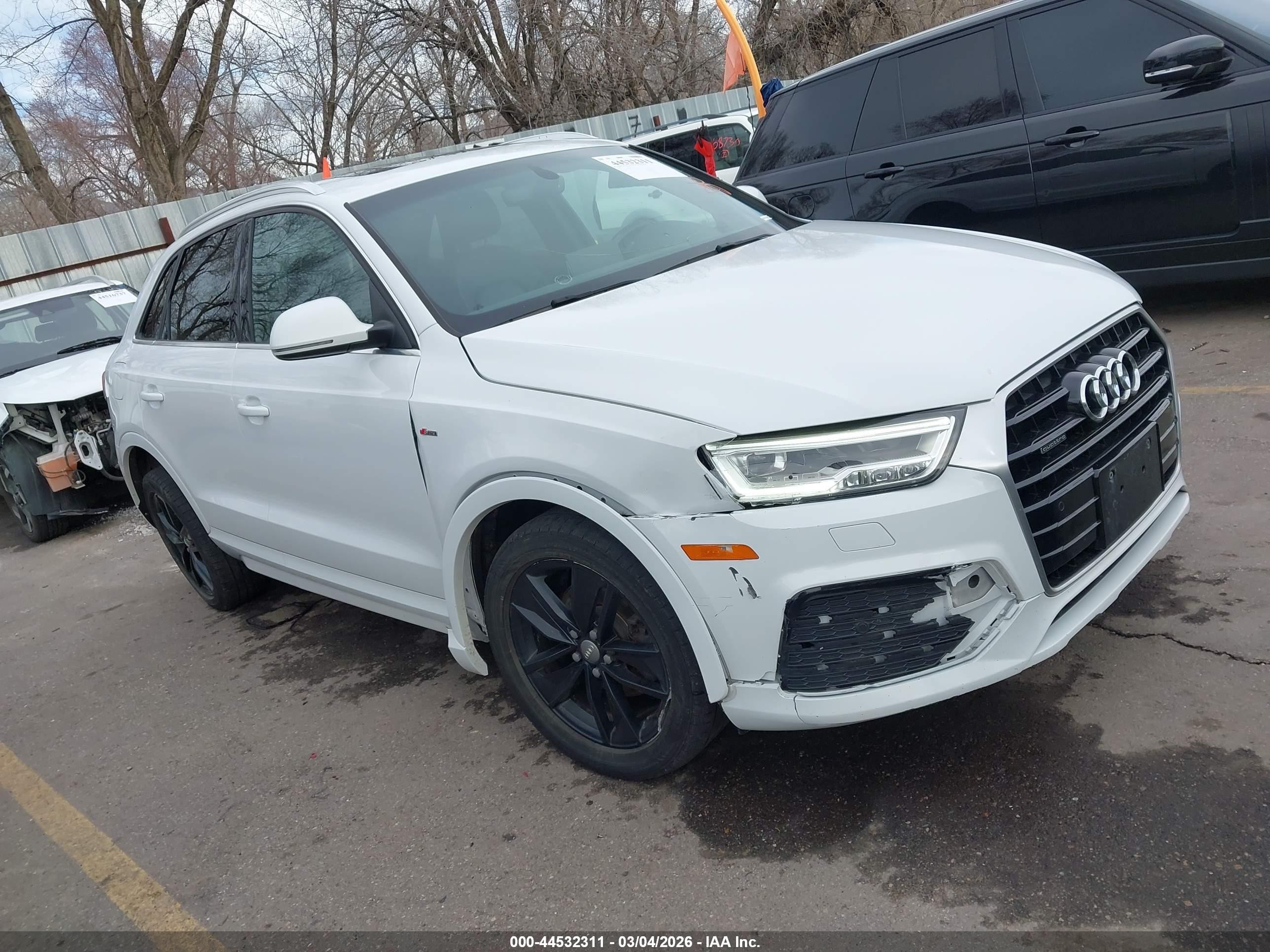 2018 Audi Q3 Premium Plus, VIN WA1JCCFS0JR010041 — Side