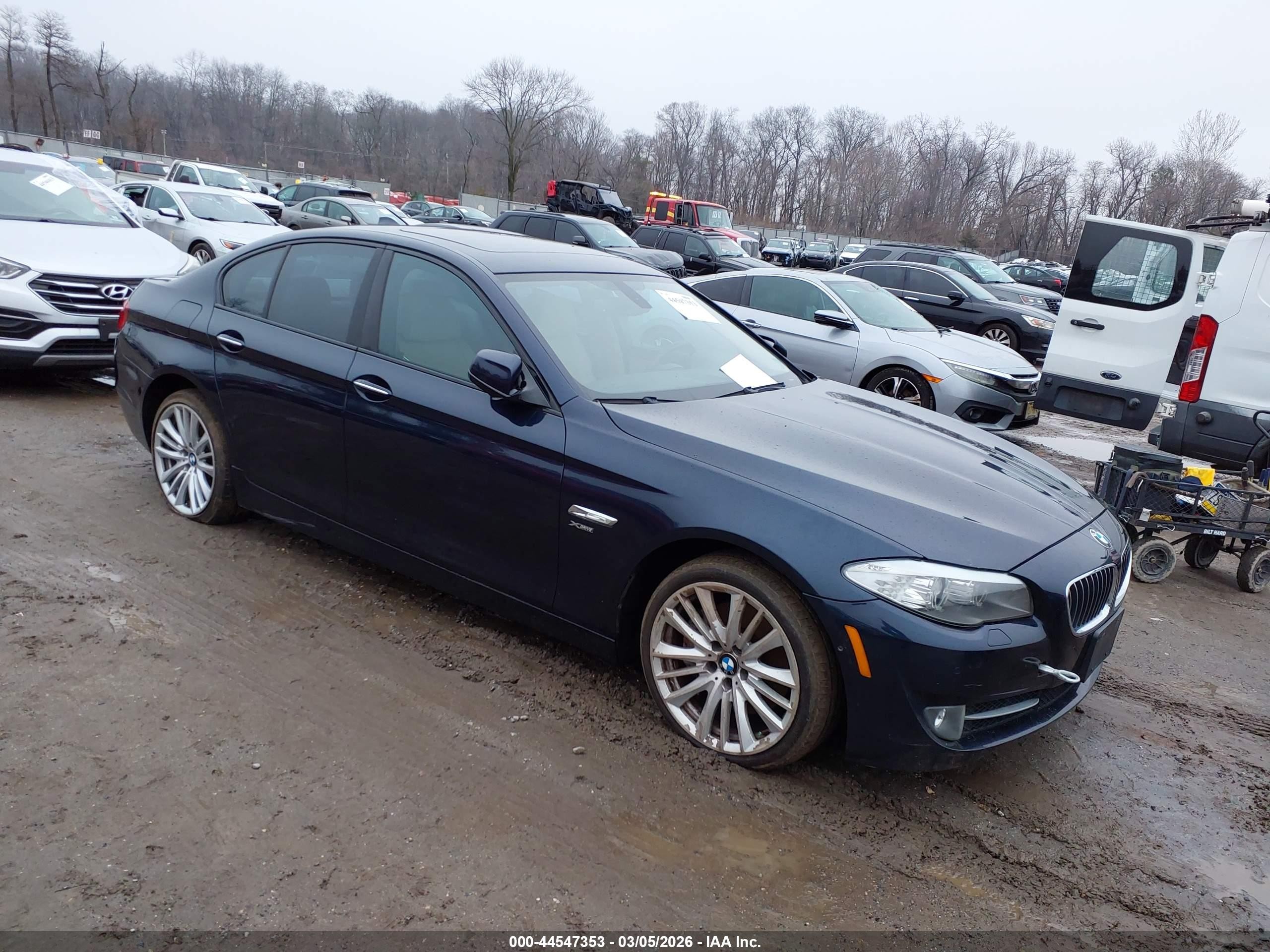 2011 BMW 5 Series 550i xDrive, VIN WBAFU9C58BC786378 — Side