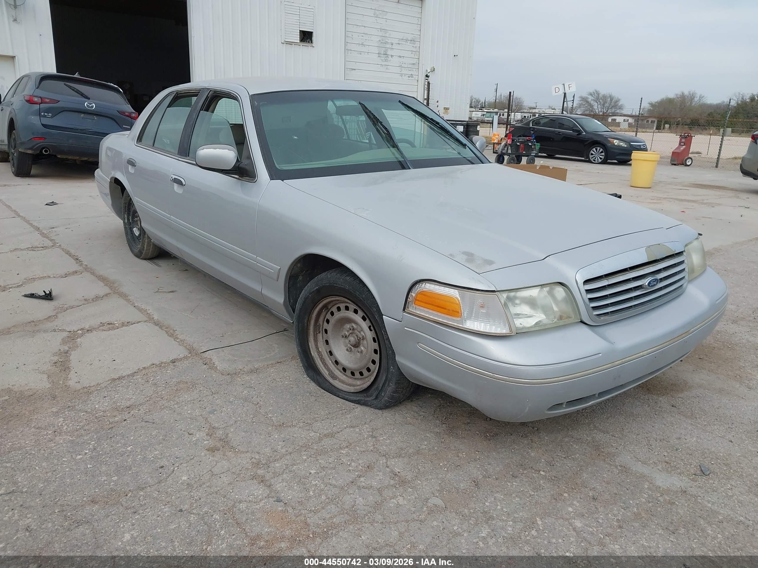 1998 Ford Crown Victoria, VIN 2FAFP73W0WX112103 — Side
