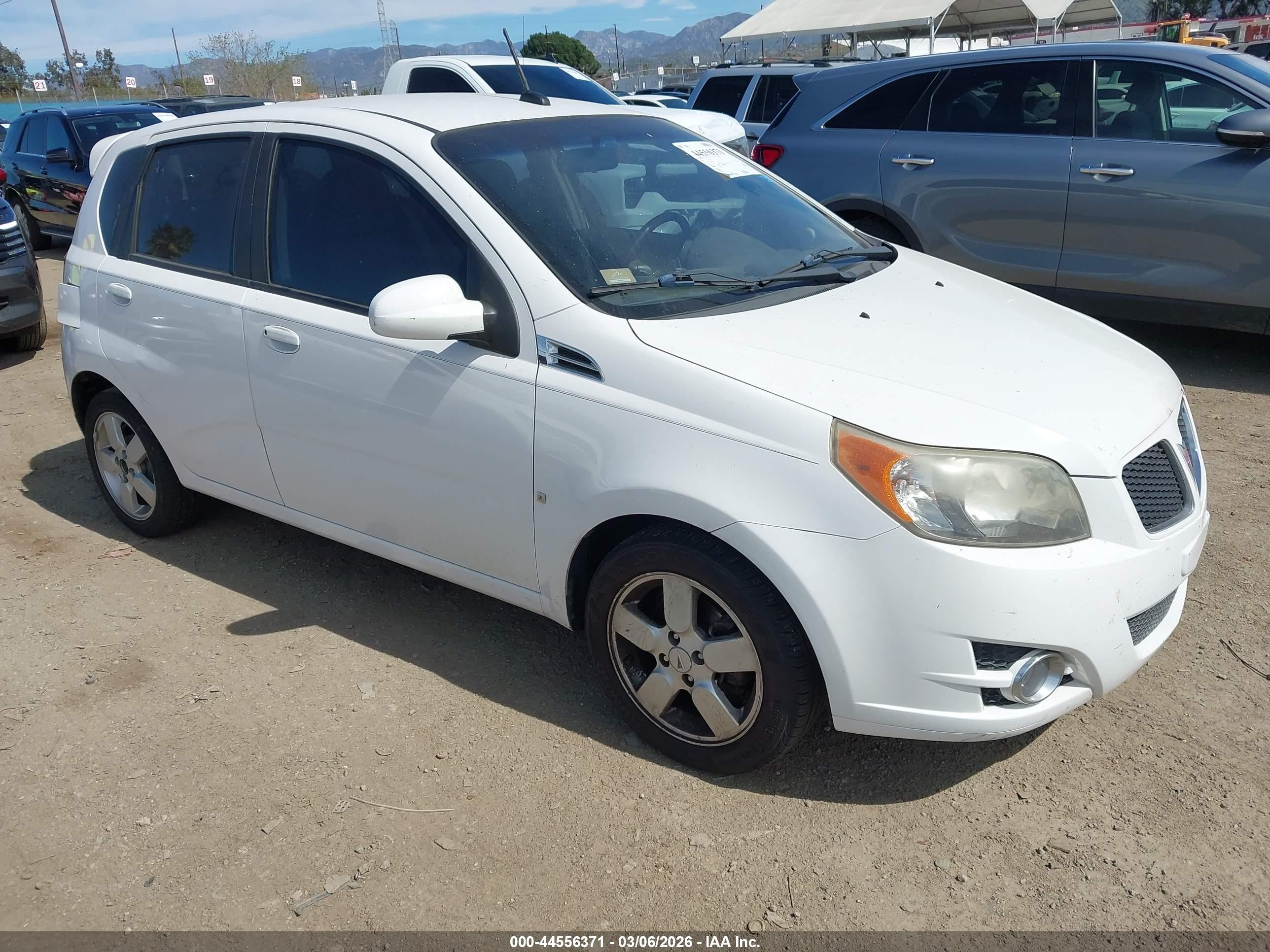 2009 Pontiac G3, VIN KL2TD66E59B665553 — Side