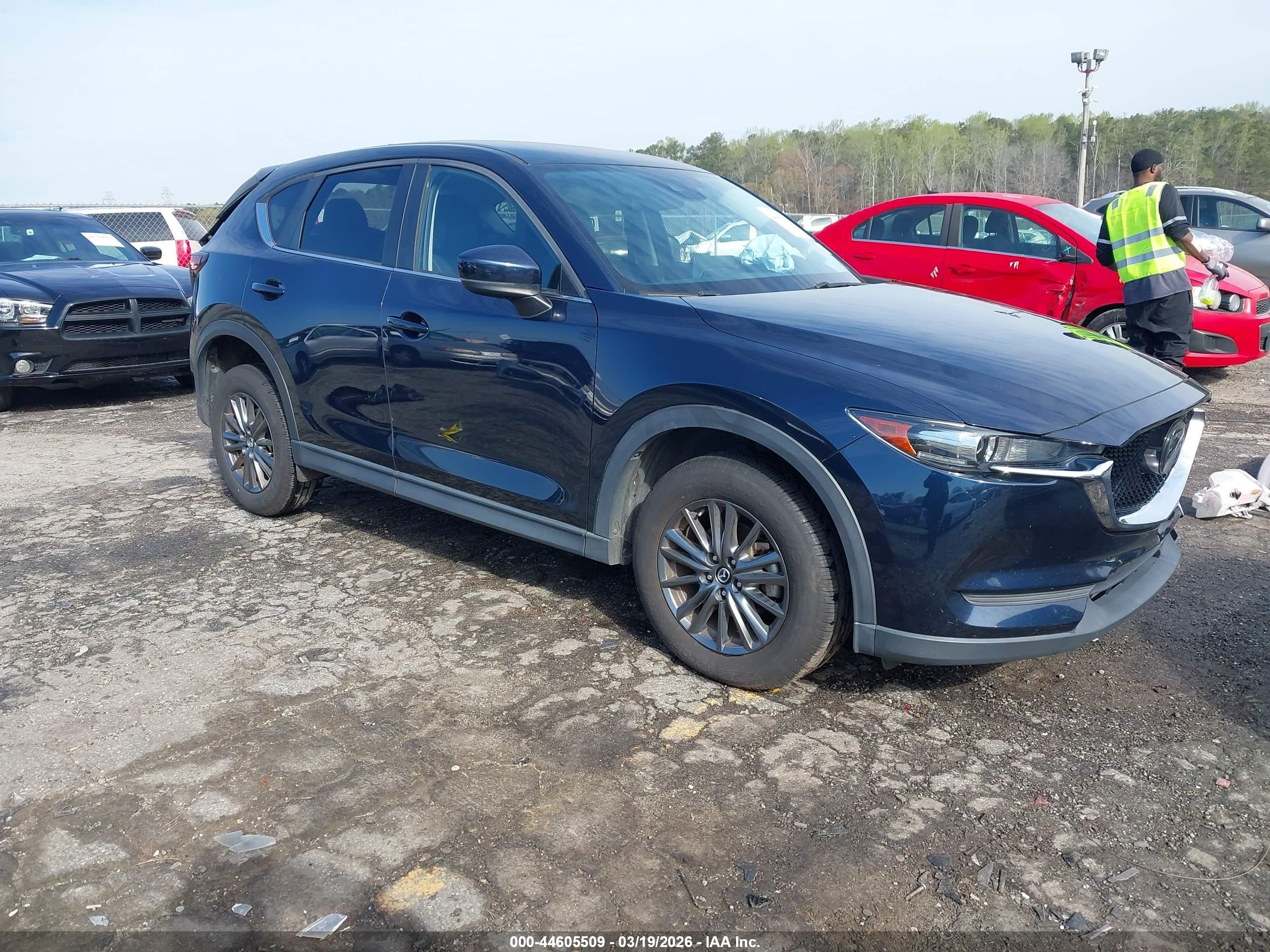 2021 Mazda CX-5 Touring, VIN JM3KFACM8M0325147 — Rear end