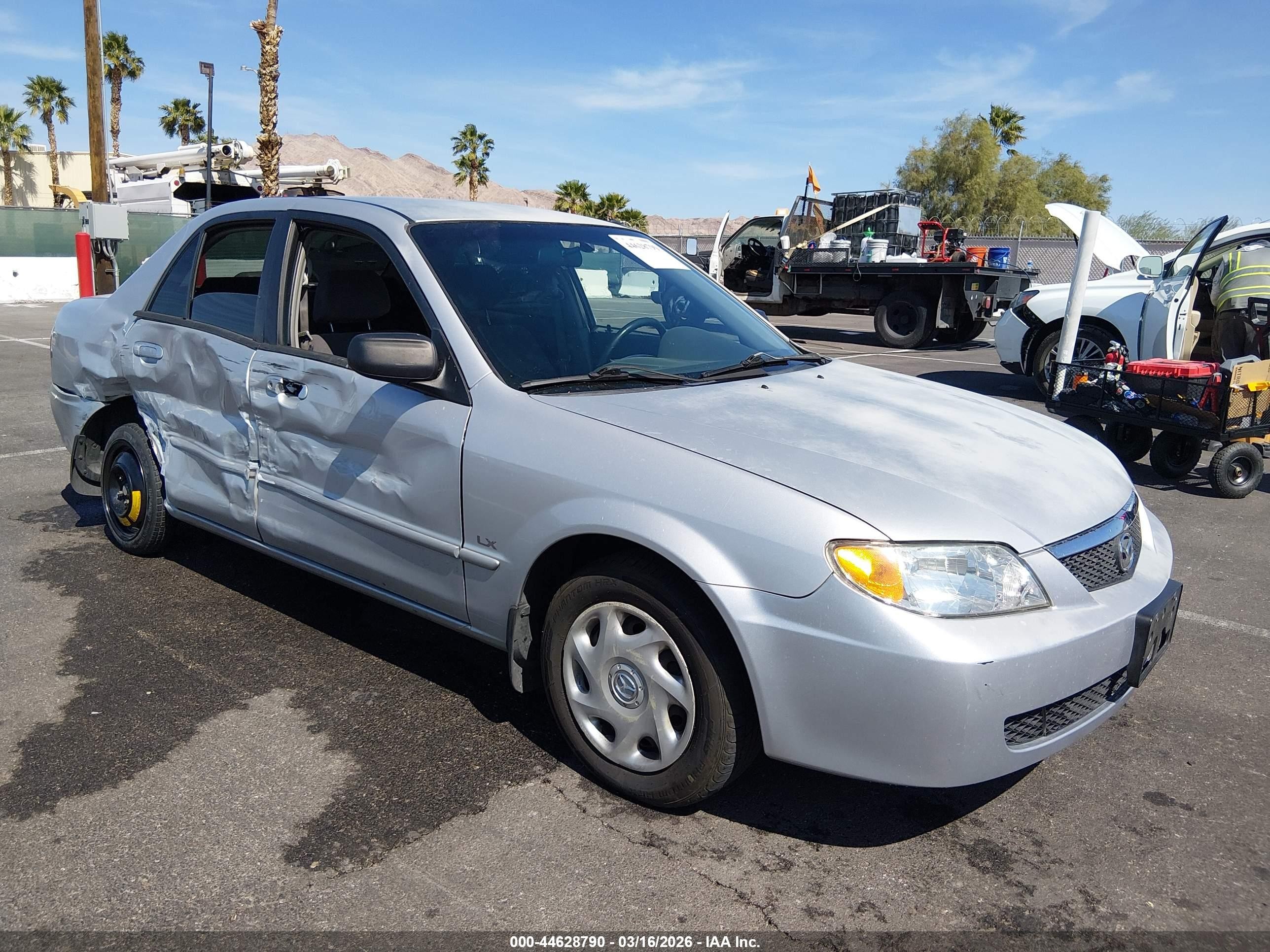 2001 Mazda Protege DX, VIN JM1BJ222610424154 — Бок