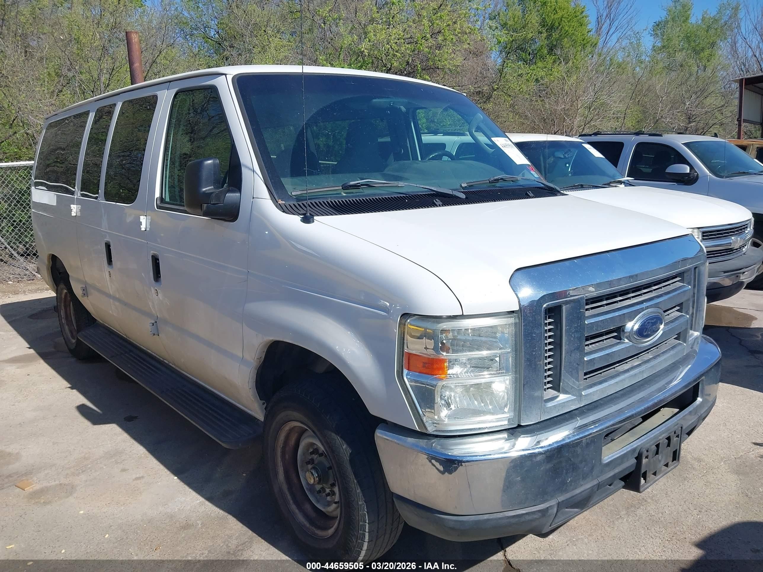 2012 Ford E-150, VIN 1FDNE1BW6CDA41739 — Side