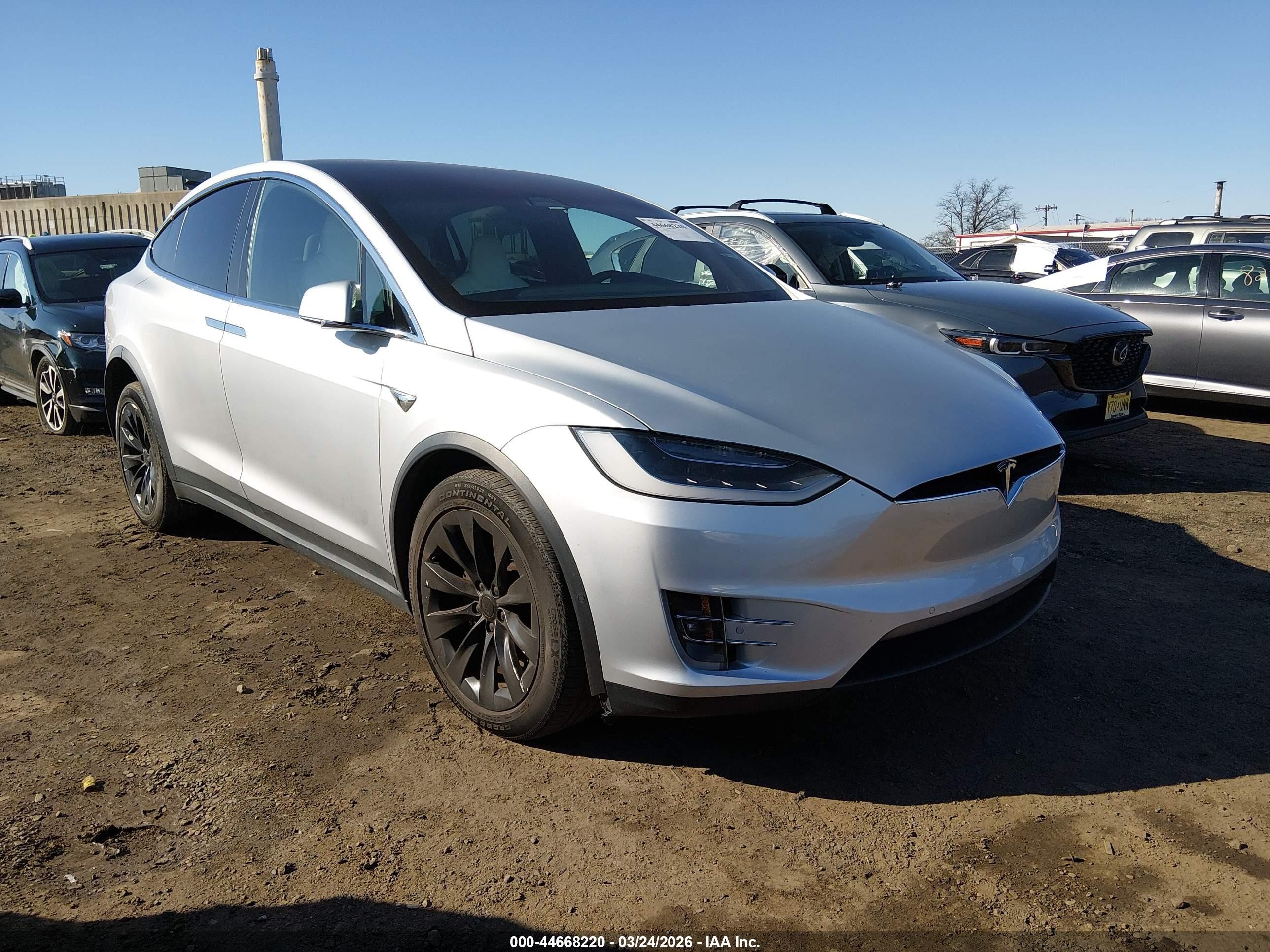 2017 Tesla Model X 90D, VIN 5YJXCAE21HF075079 — Side