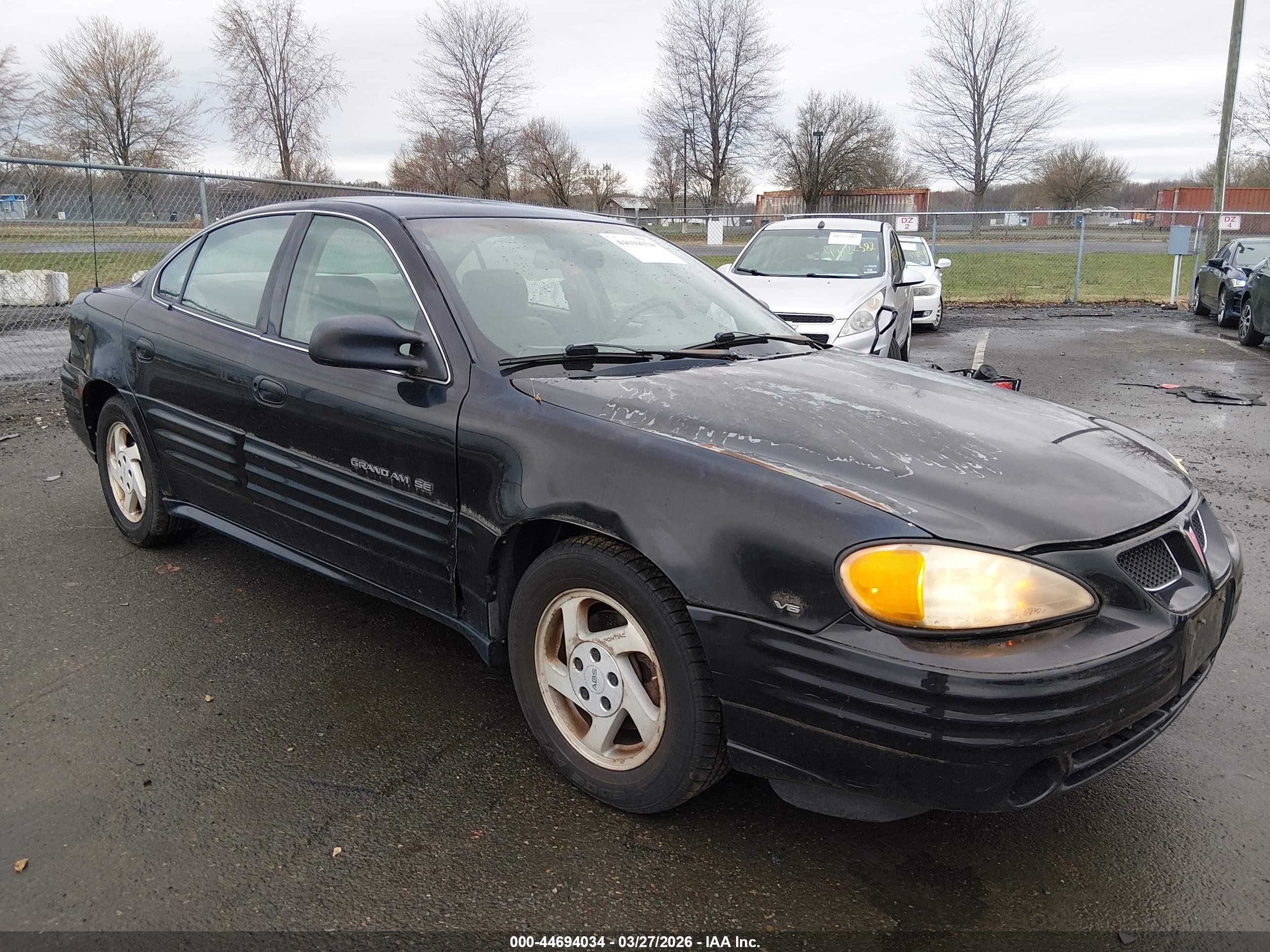 1999 Pontiac Grand Am SE1, VIN 1G2NE52E0XC583132 — Side