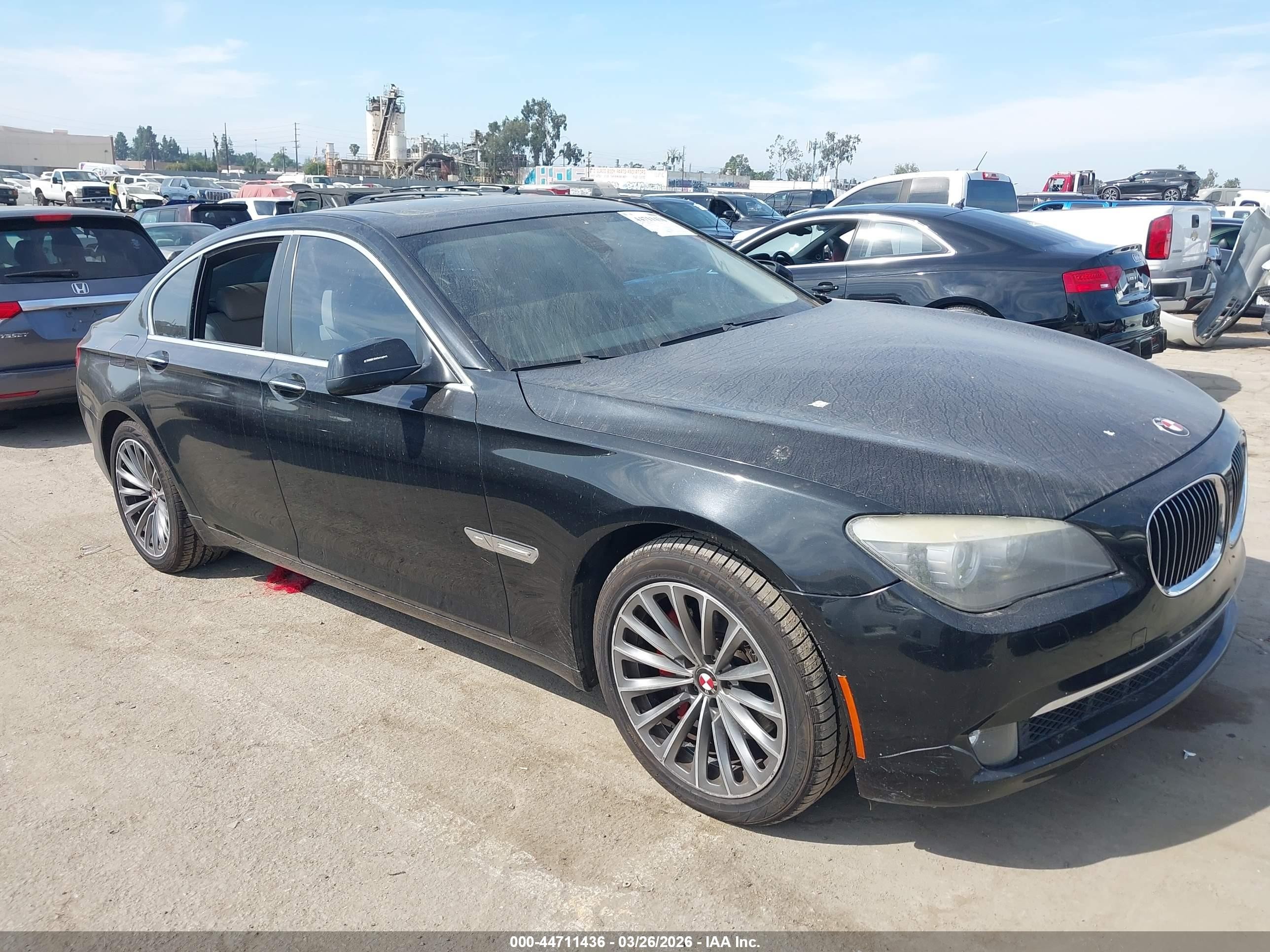 2011 BMW 7 Series 740i, VIN WBAKA4C5XBC613150 — Side