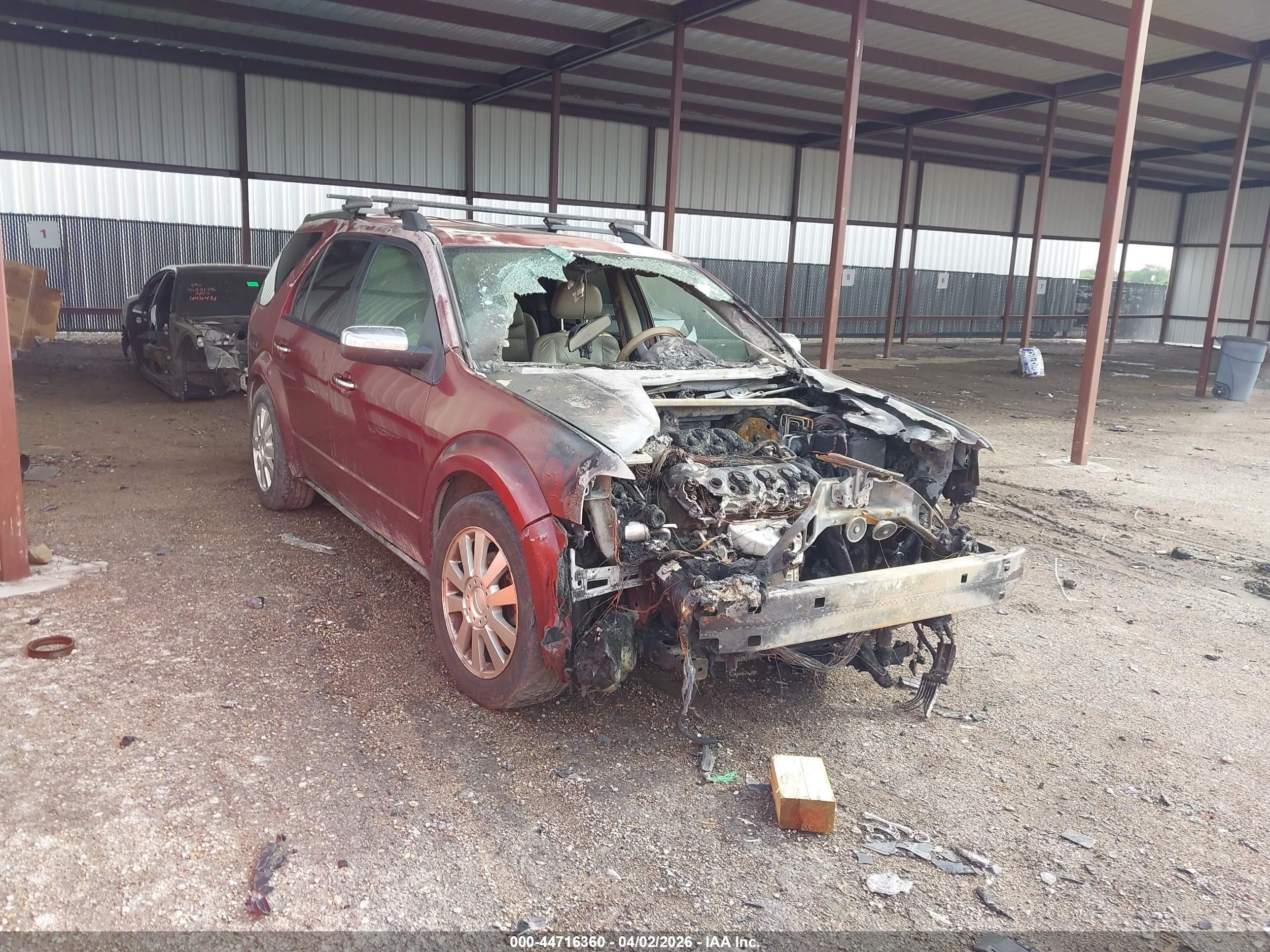2008 Ford Taurus X Limited, VIN 1FMDK06W88GA06683 — Engine fire