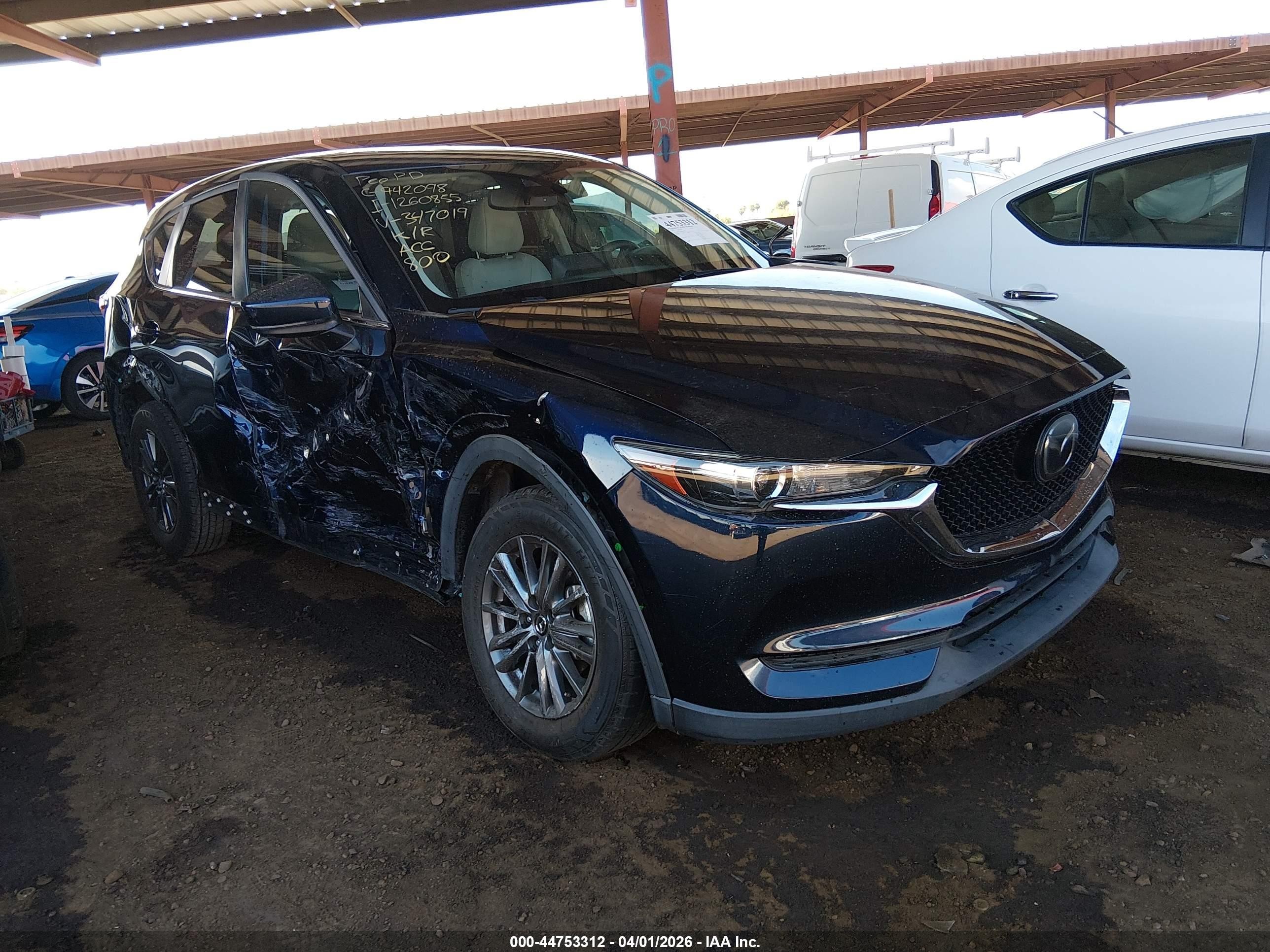 2021 Mazda CX-5 Touring, VIN JM3KFACMXM0347019 — Side